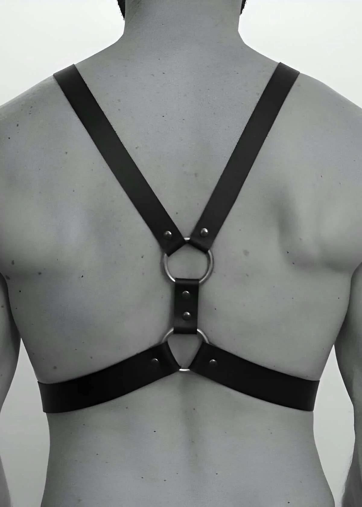 close-up of silver rectangular buckle on black faux leather shoulder strap