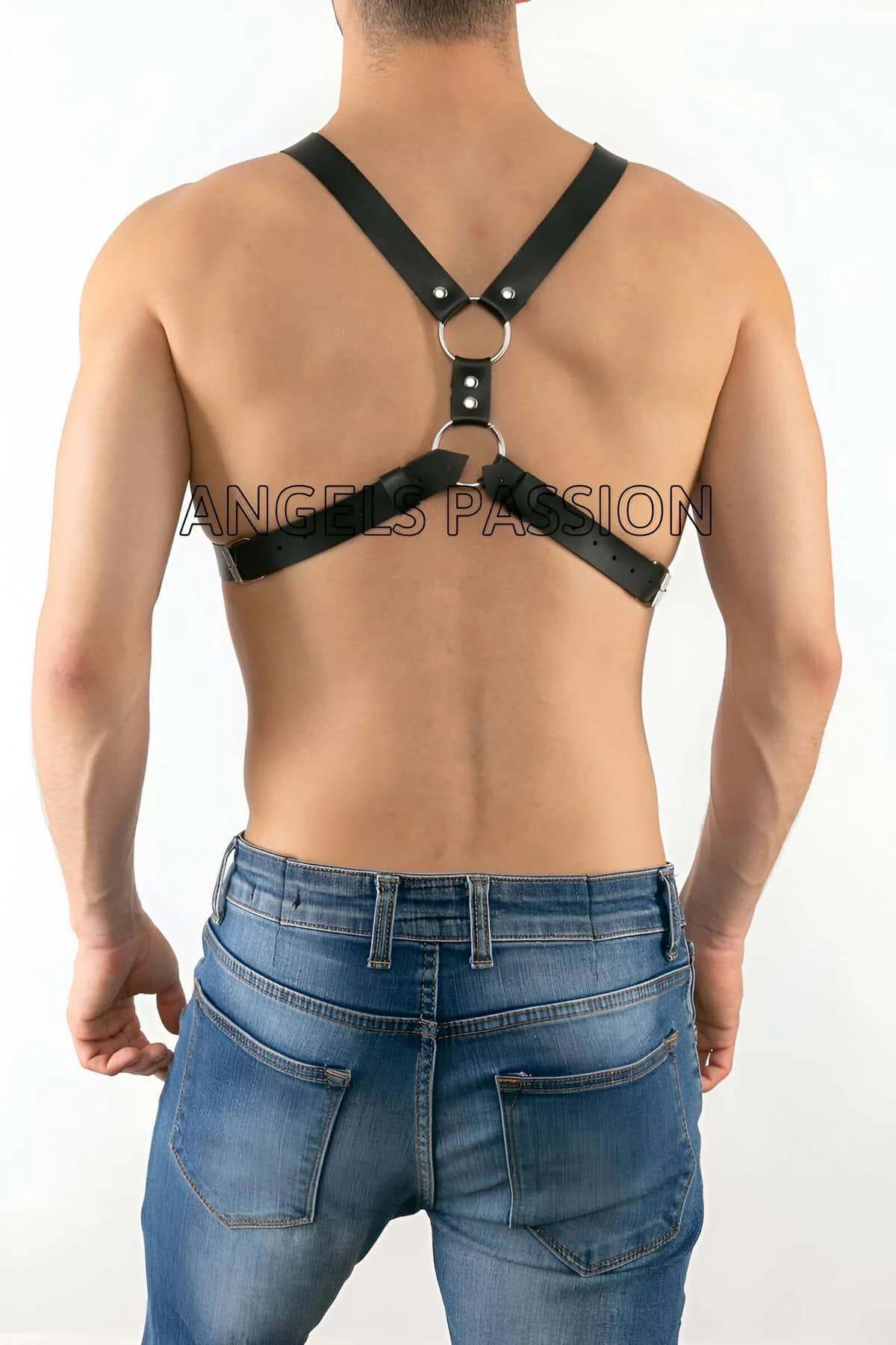 Adjustable black PU chest harness X-brace strap configuration front view on male torso
