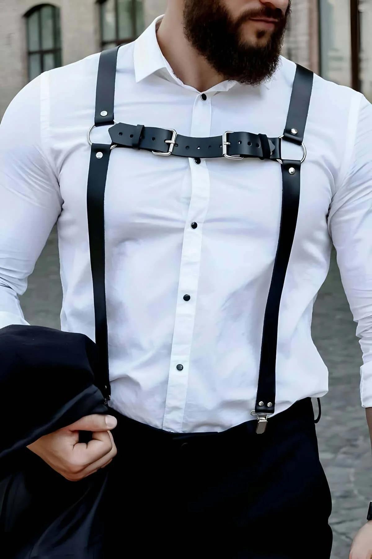 close-up of silver D-ring and rivet stud detail on black faux leather Y-back harness shoulder junction