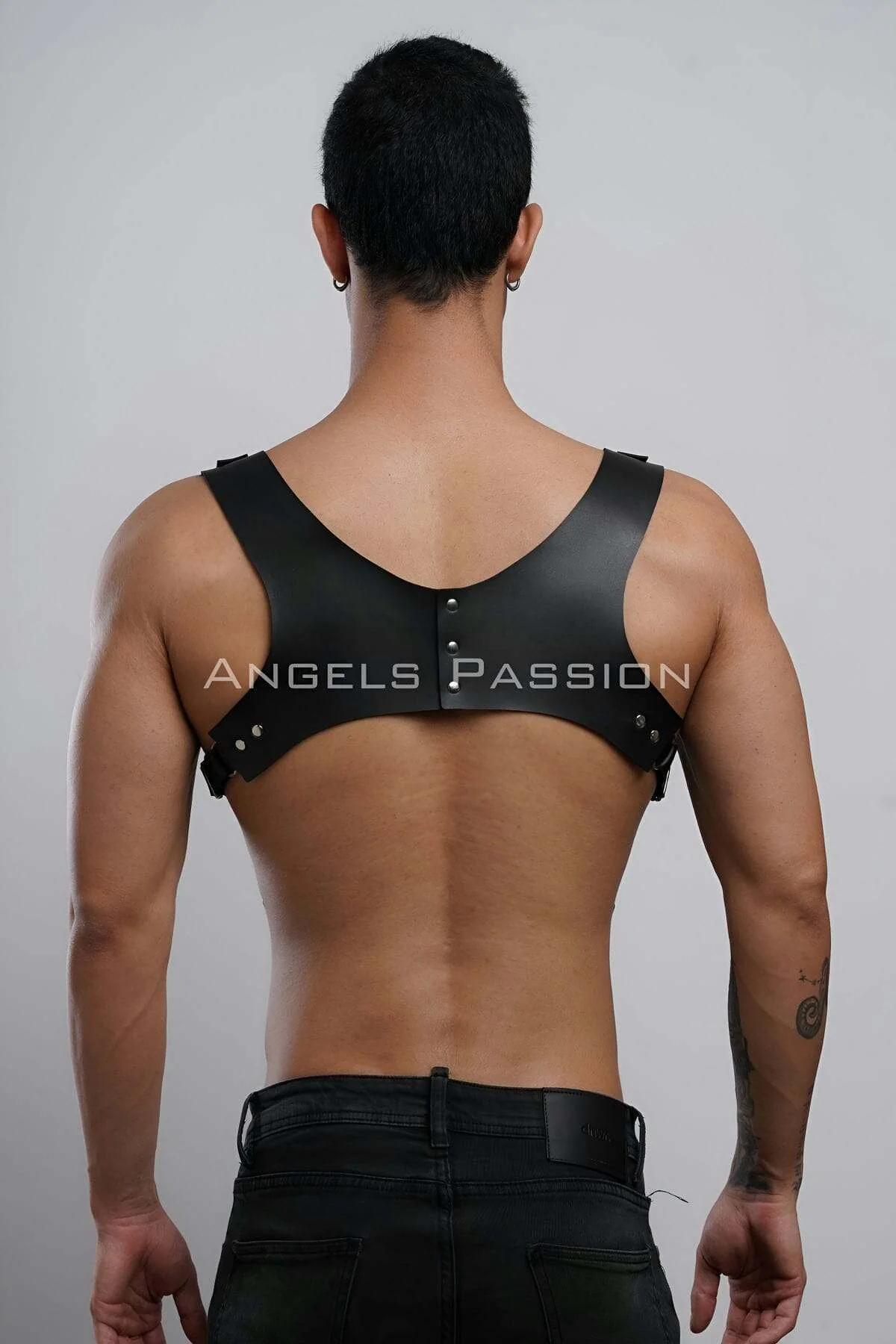 Close-up of silver zinc-alloy roller buckles on black PU leather shoulder straps