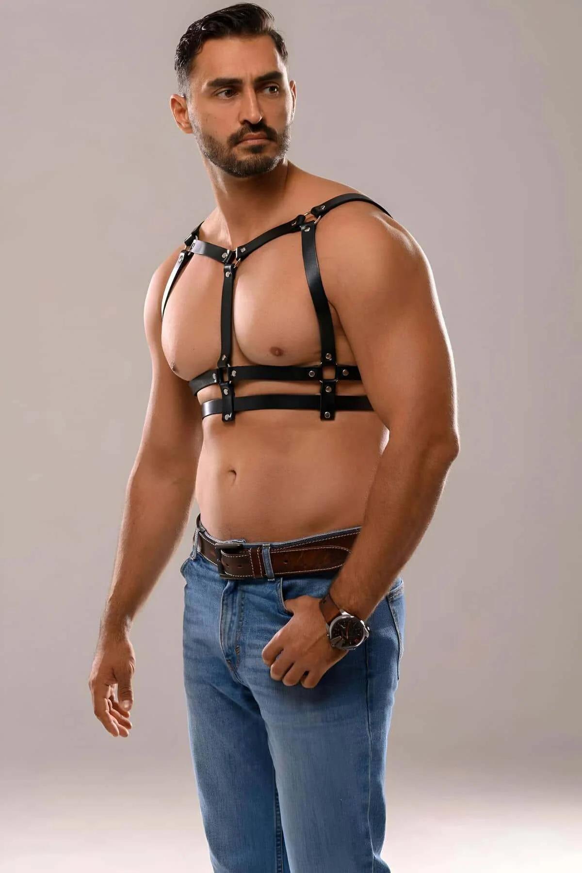 Black PU leather chest harness worn over bare torso showing full strap structure and fit