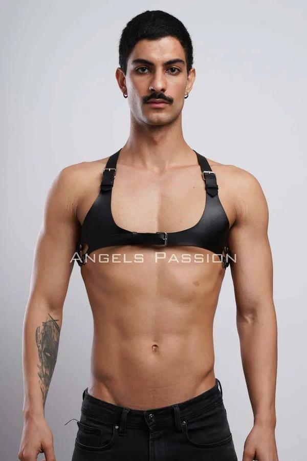 black matte faux leather chest harness wide front panel adjustable buckle straps worn by male model
