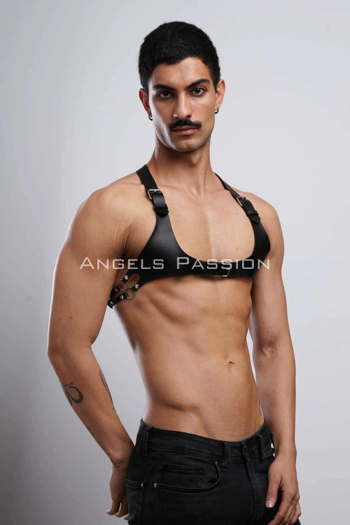 mens black chest harness layered over bare torso with central front buckle visible