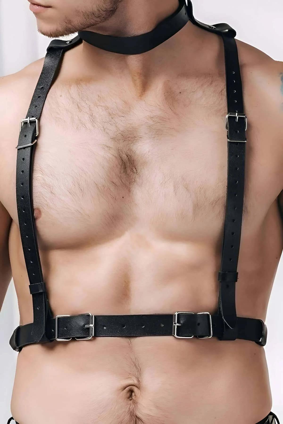 Black faux leather chest harness with choker, silver rectangular buckles, worn by a man showing adjustable shoulder and waist