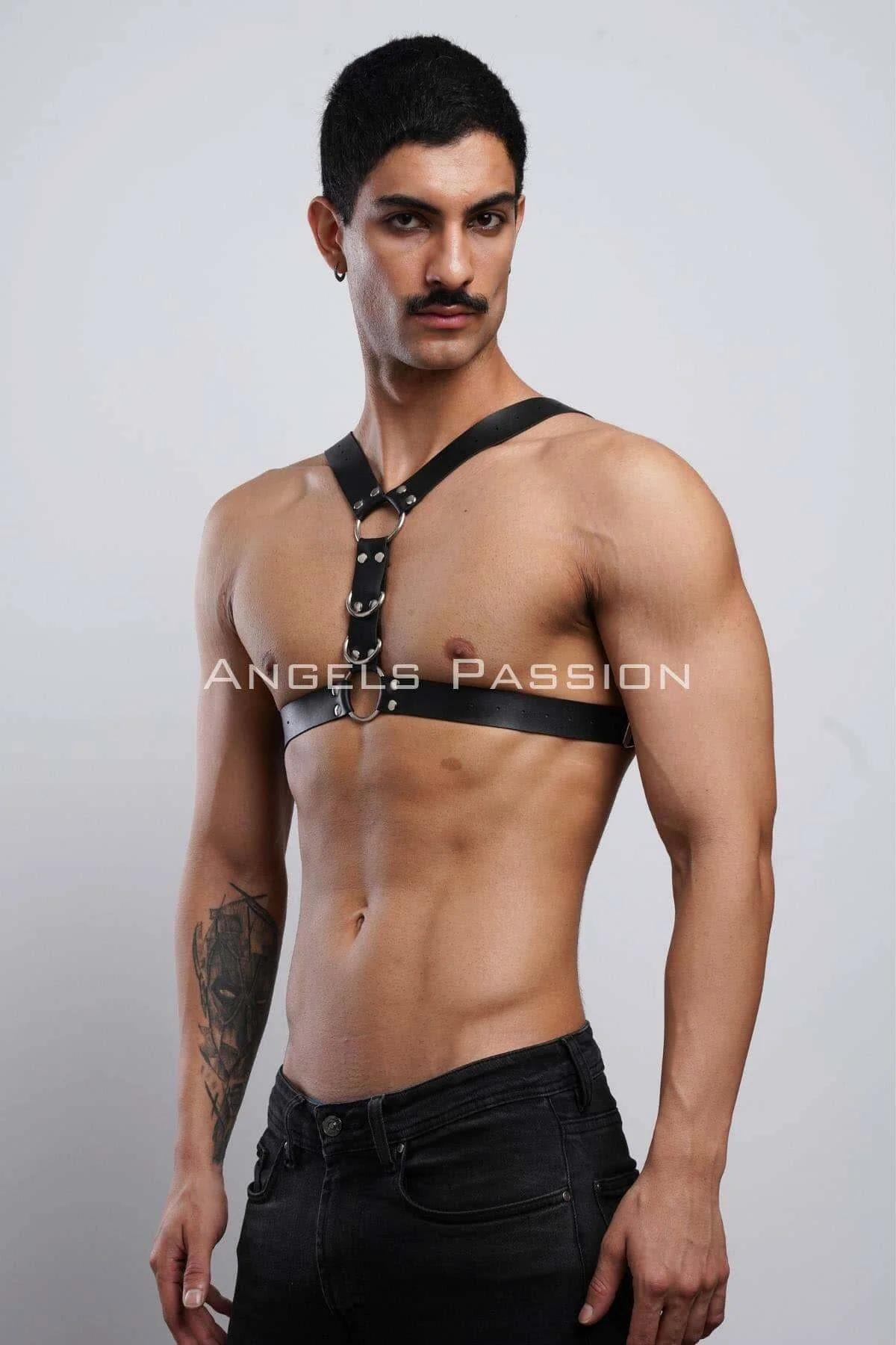 close-up of silver O-ring and rivet stud detail on black faux leather chest harness