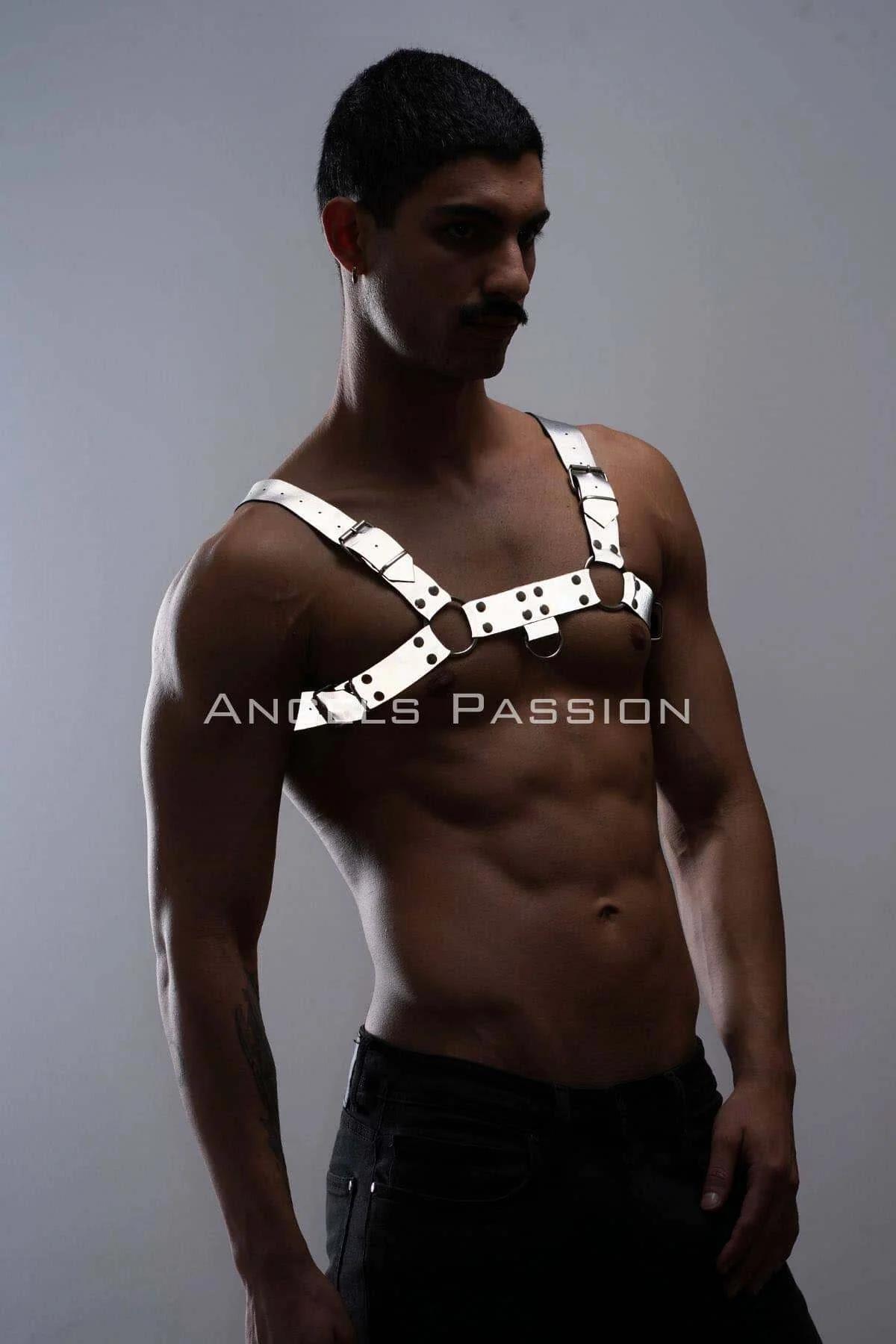 Detail shot of black O-ring accent and reflective surface texture on festival chest harness