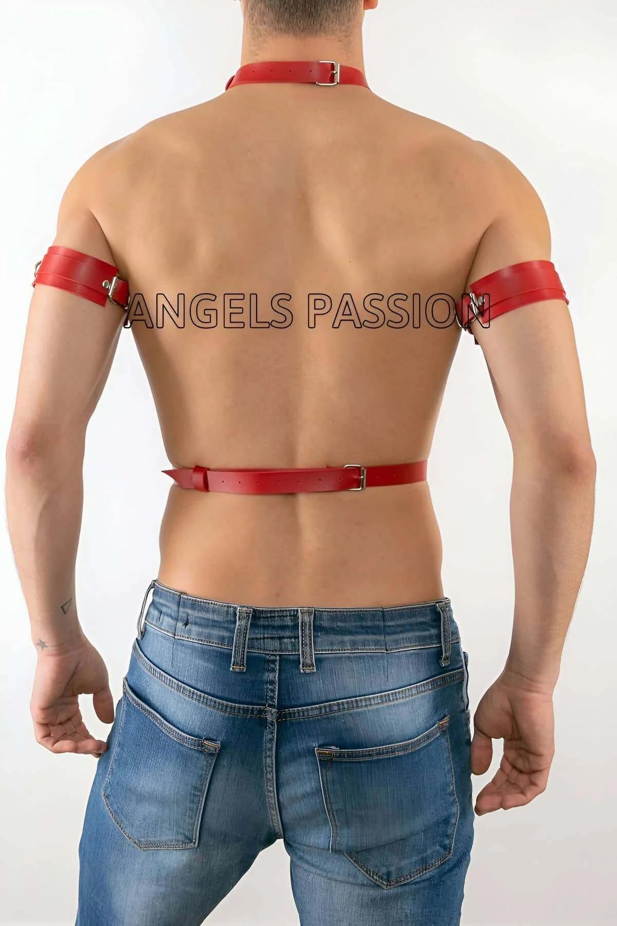 Close-up of red faux leather strap detail and silver pin buckle on mens chest harness