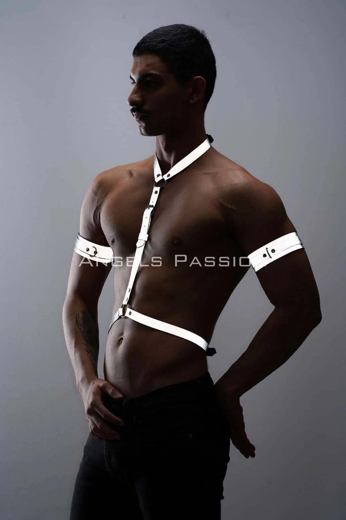 Close-up of gunmetal snap-button closures on white synthetic reflective strap harness