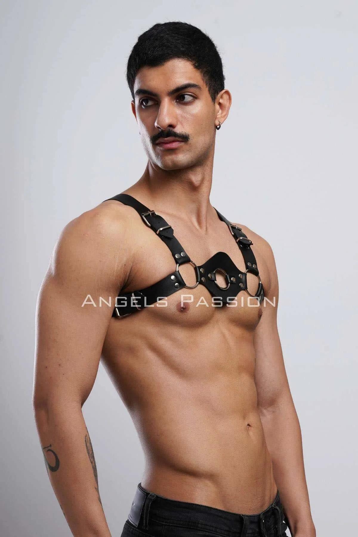 Matte black PU leather chest harness with three silver-tone rings and adjustable shoulder buckles front view