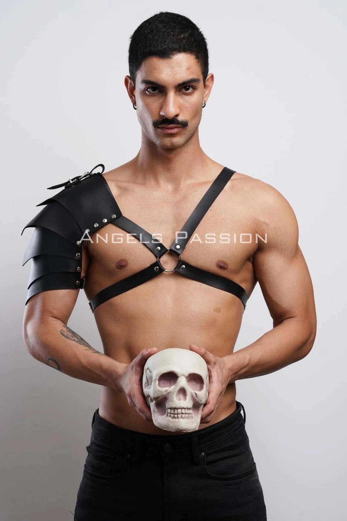 Side view of asymmetric black shoulder harness showing diagonal chest strap and O-ring connector