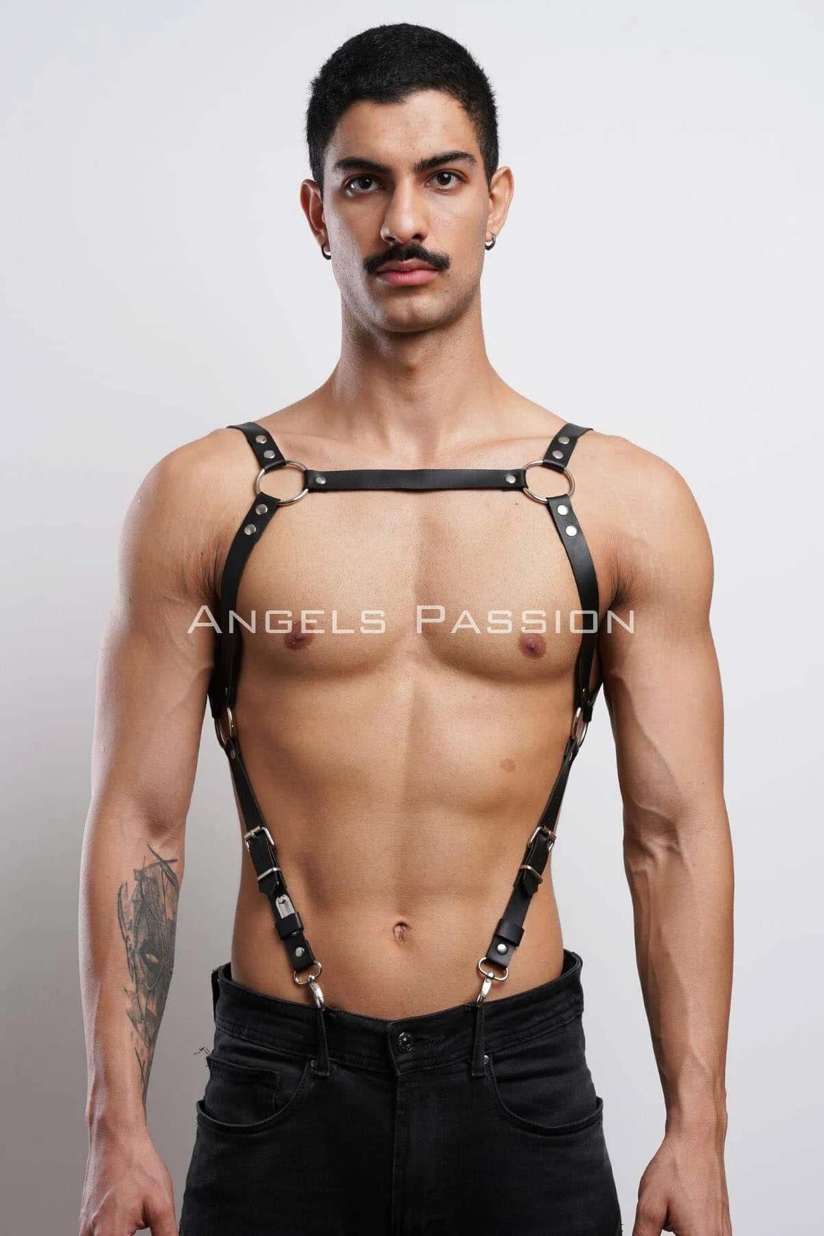 Close-up of silver O-ring detail on black faux leather chest harness strap