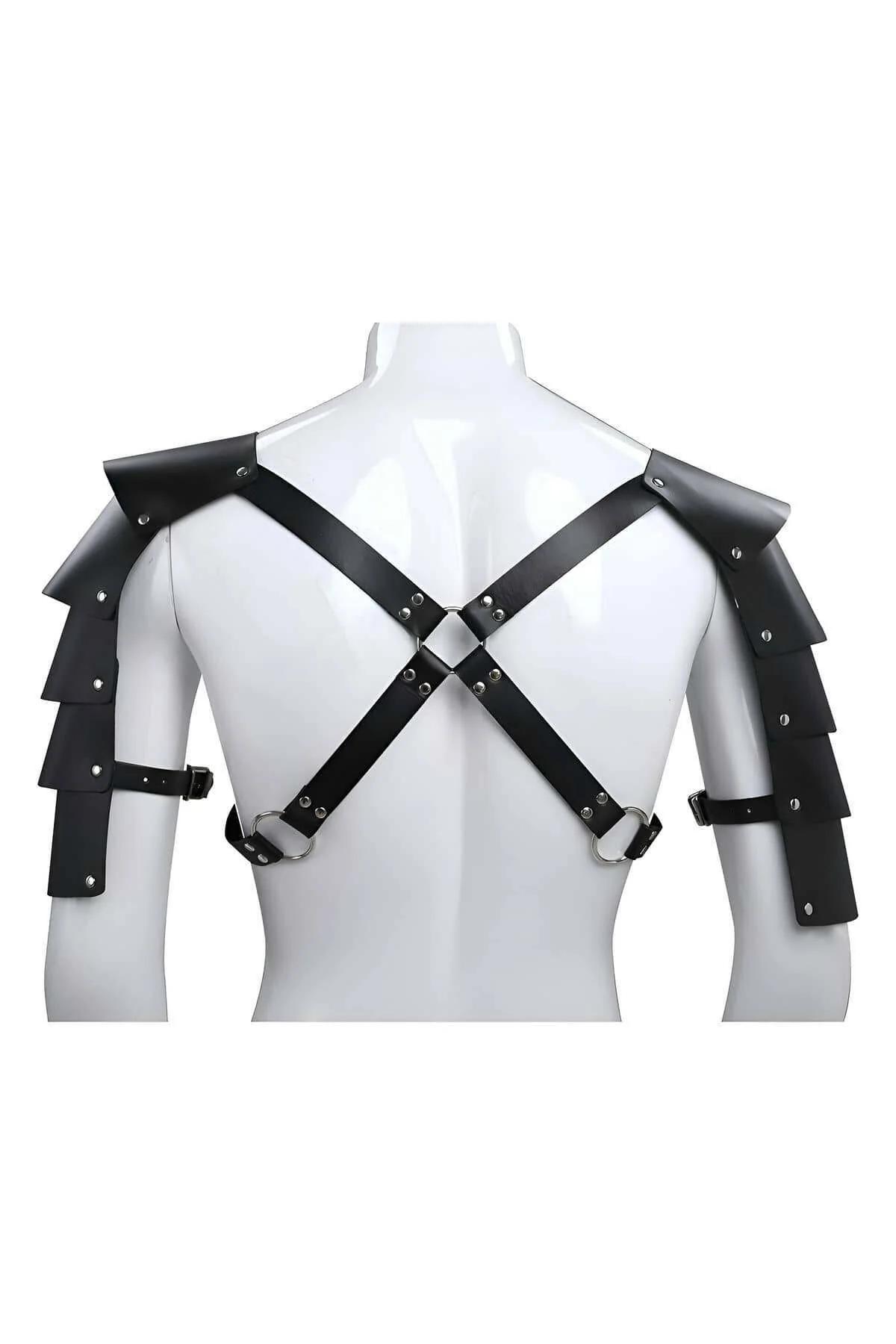Close-up of black faux leather three-tier pauldron plates with silver dome rivets on shoulder armor harness