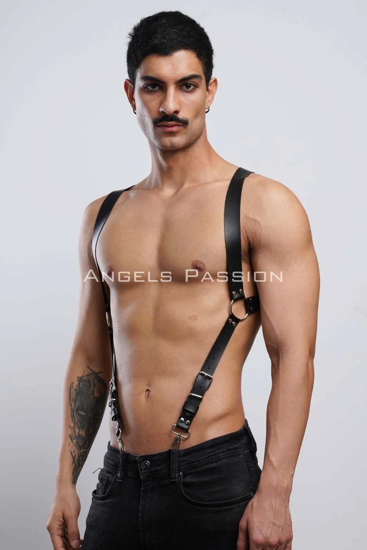 side angle of black leather-look full body harness worn over bare torso with black jeans