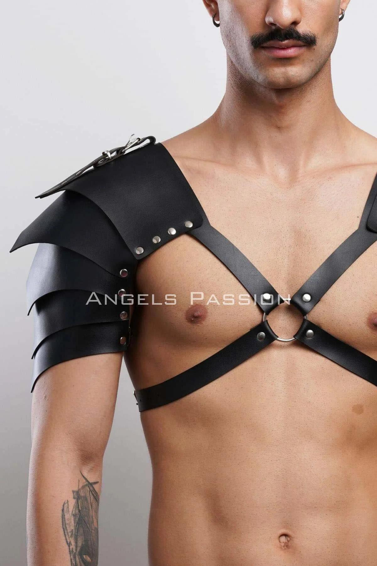 Close-up of black faux leather pauldron panels with silver-tone rivet detailing on layered armor segments