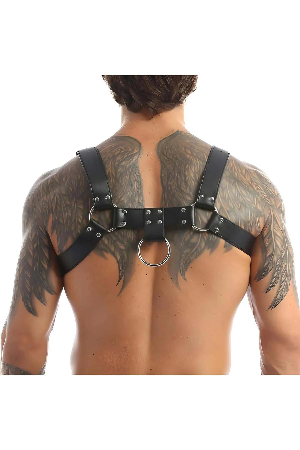 close-up of silver stud row and O-ring detail on black faux leather chest band