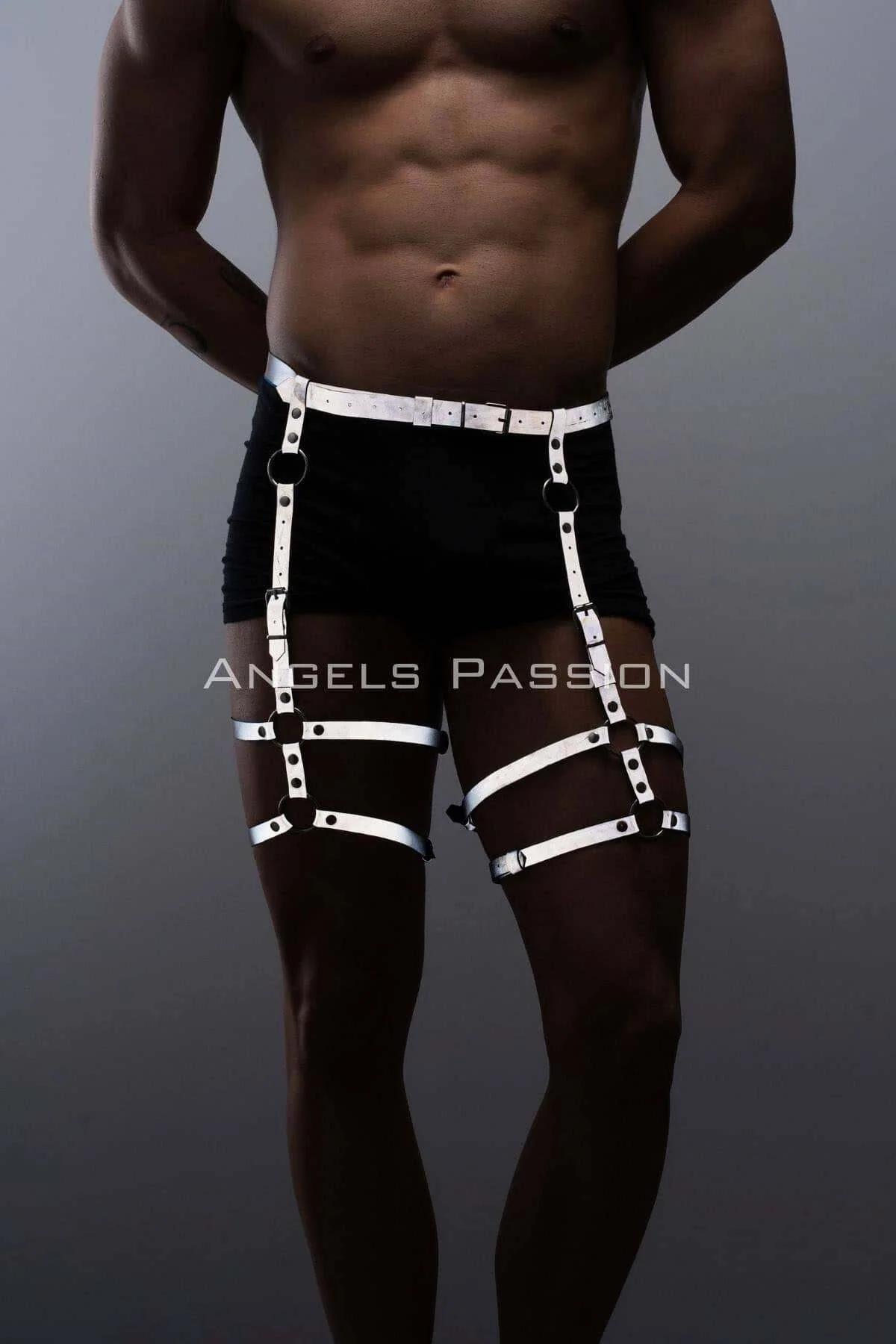 close-up of white reflective PVC strap with silver eyelet hardware on thigh harness