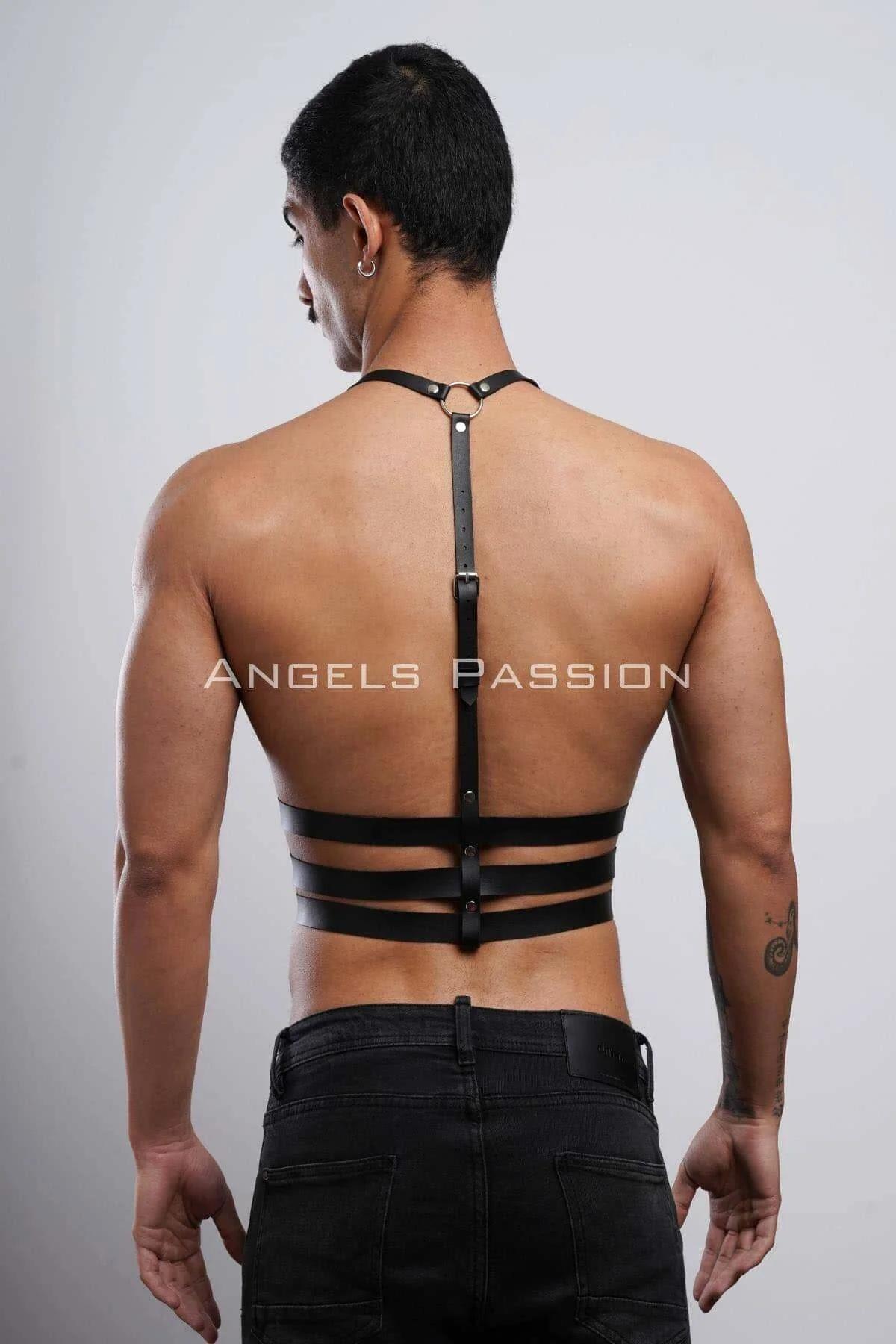 Full-length view of black faux leather chest harness with ladder-style three-band layout over bare torso