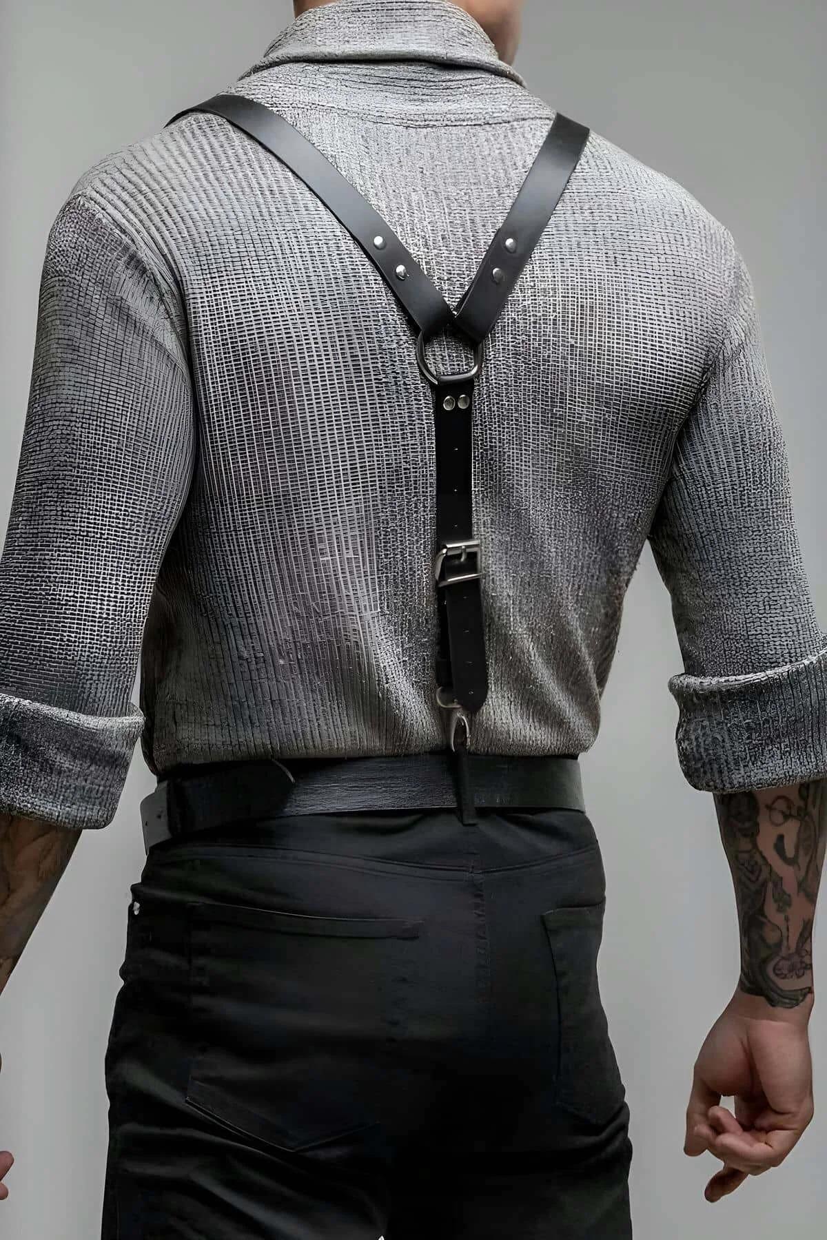 Adjustable black vegan leather shoulder harness showing chest O-ring and silver spring-clip closures