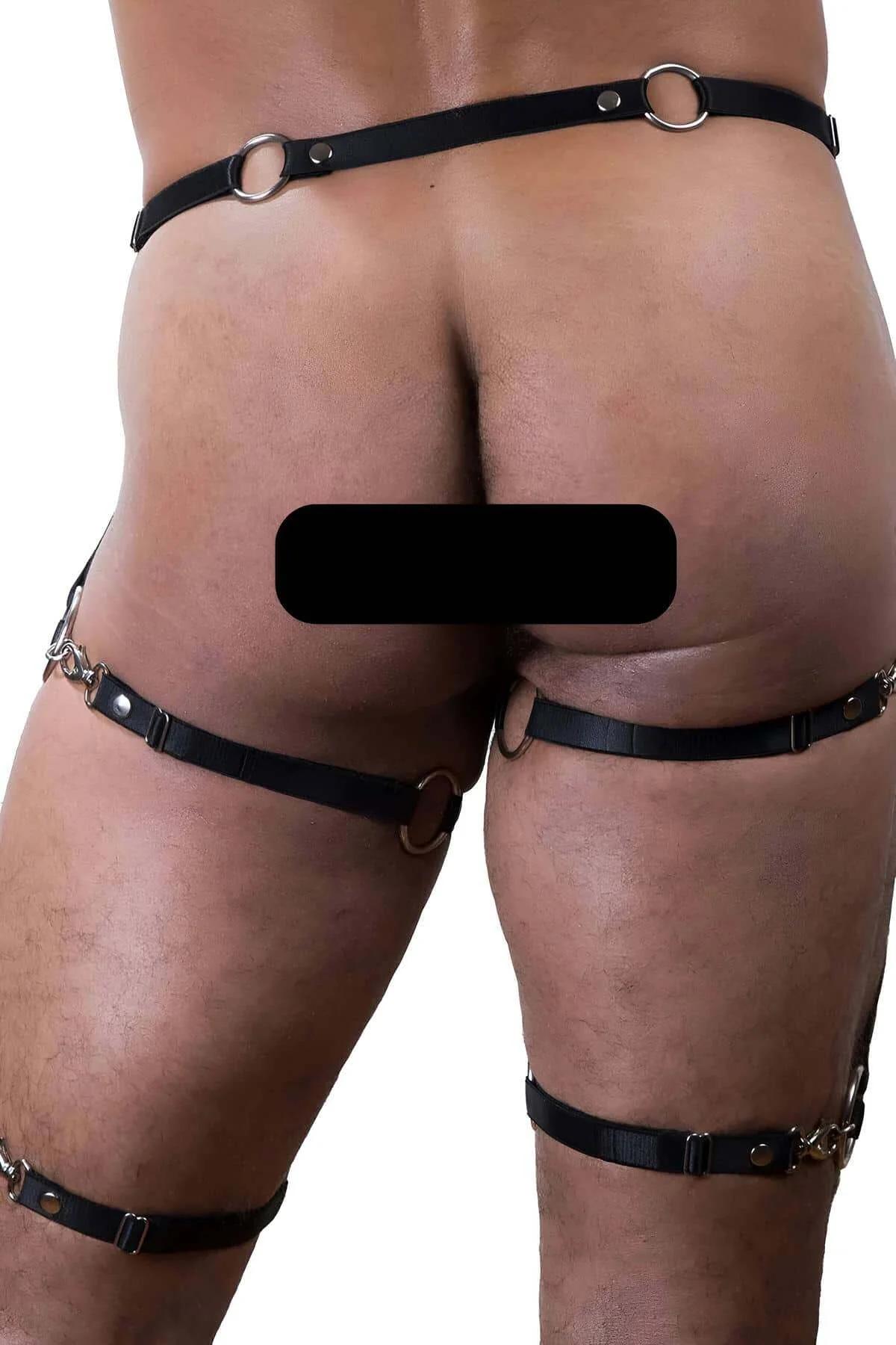 full body harness leg bands showing diagonal cross-strap pattern on thighs in black faux leather