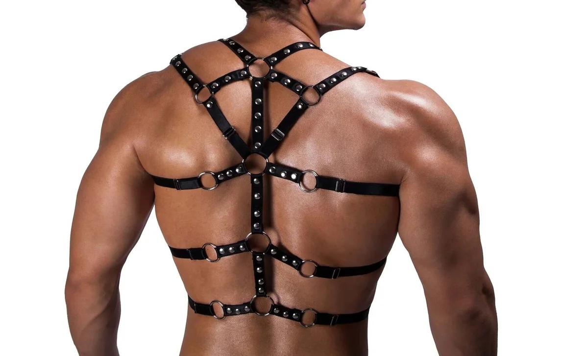 Adjustable metal pin buckle detail on 2 cm wide black faux leather harness strap