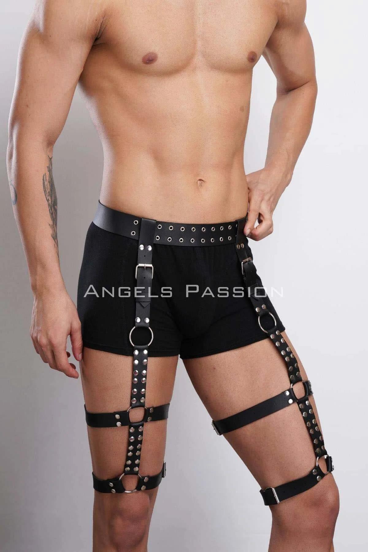 rear view of black studded leg harness showing vertical connector straps and roller-bar buckles