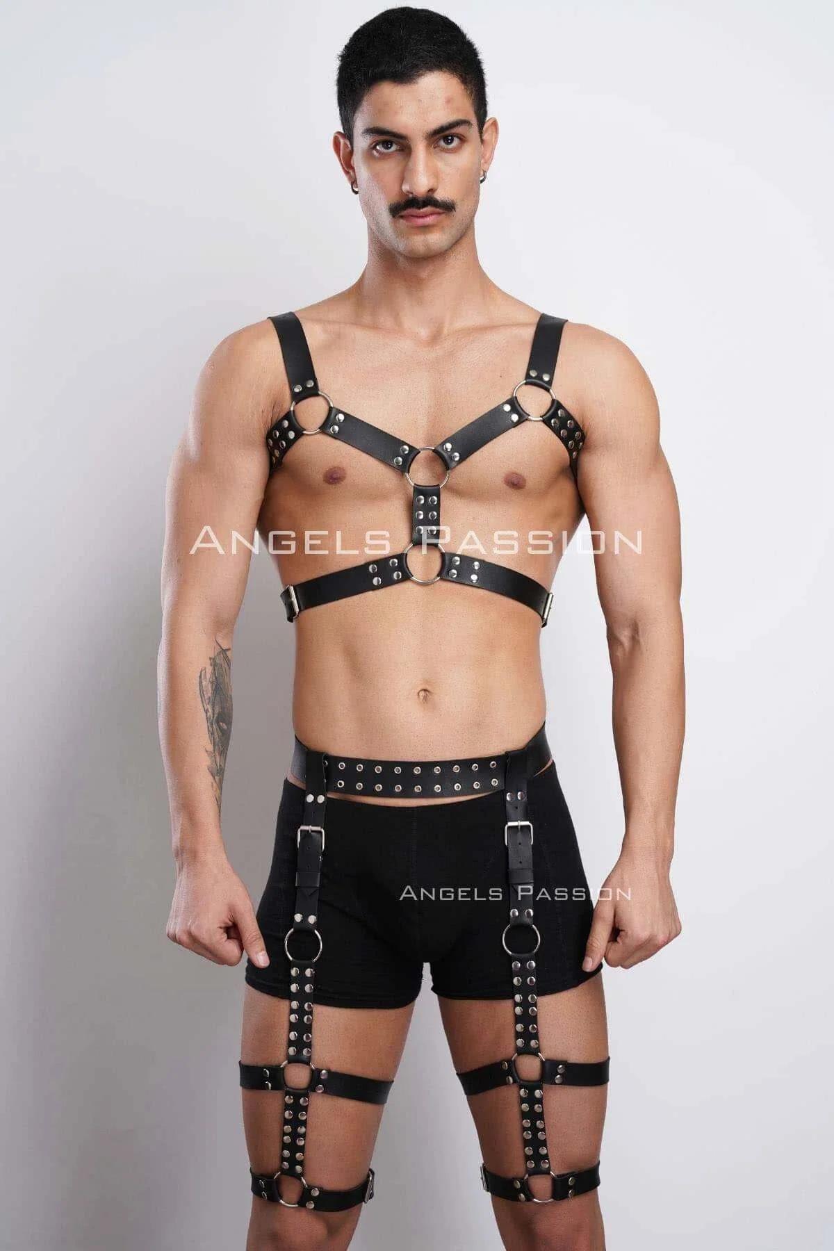 close-up of black faux leather chest harness with three silver O-rings and stud rivets