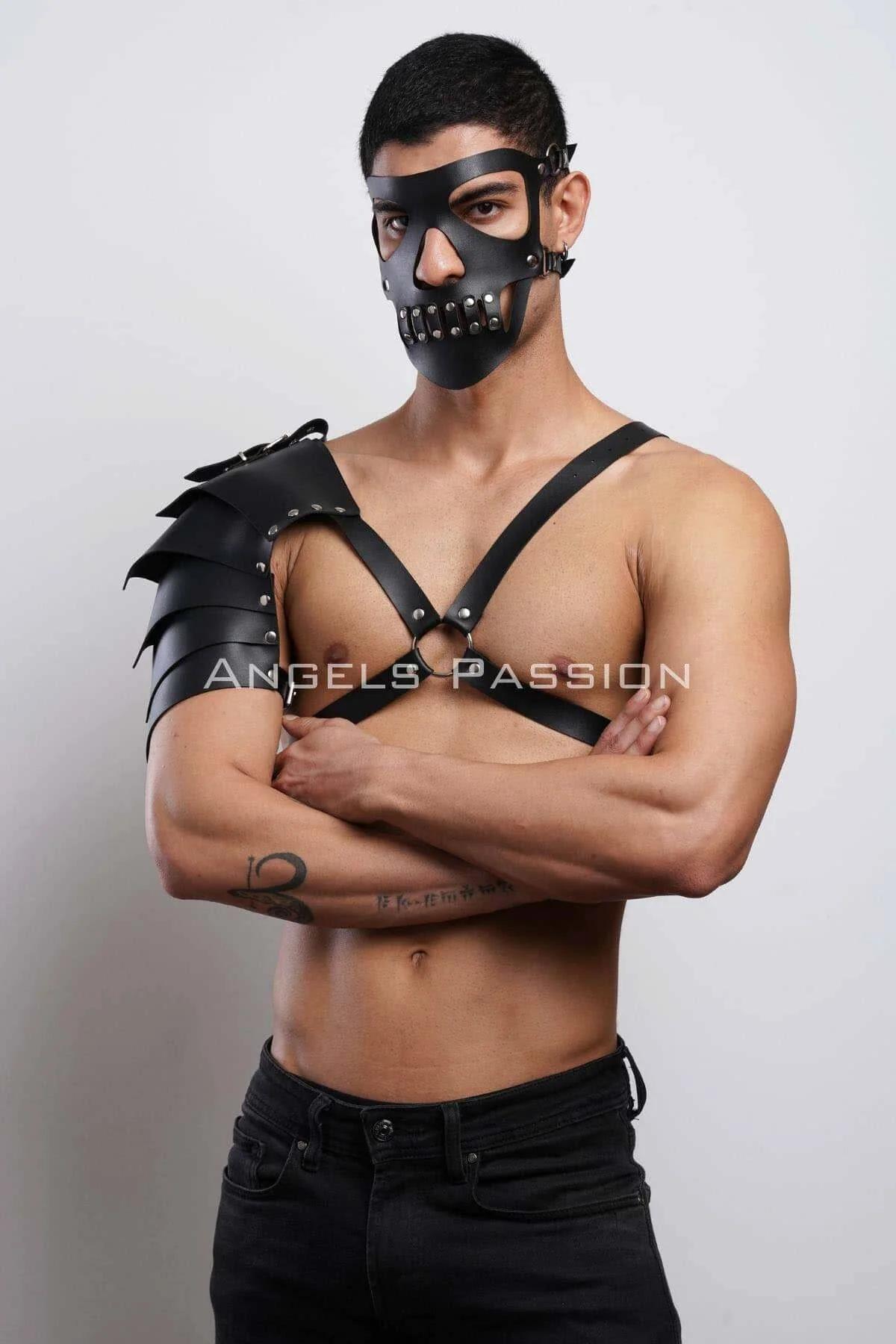 matte black PU pauldron harness diagonal chest strap side angle showing asymmetric shoulder coverage