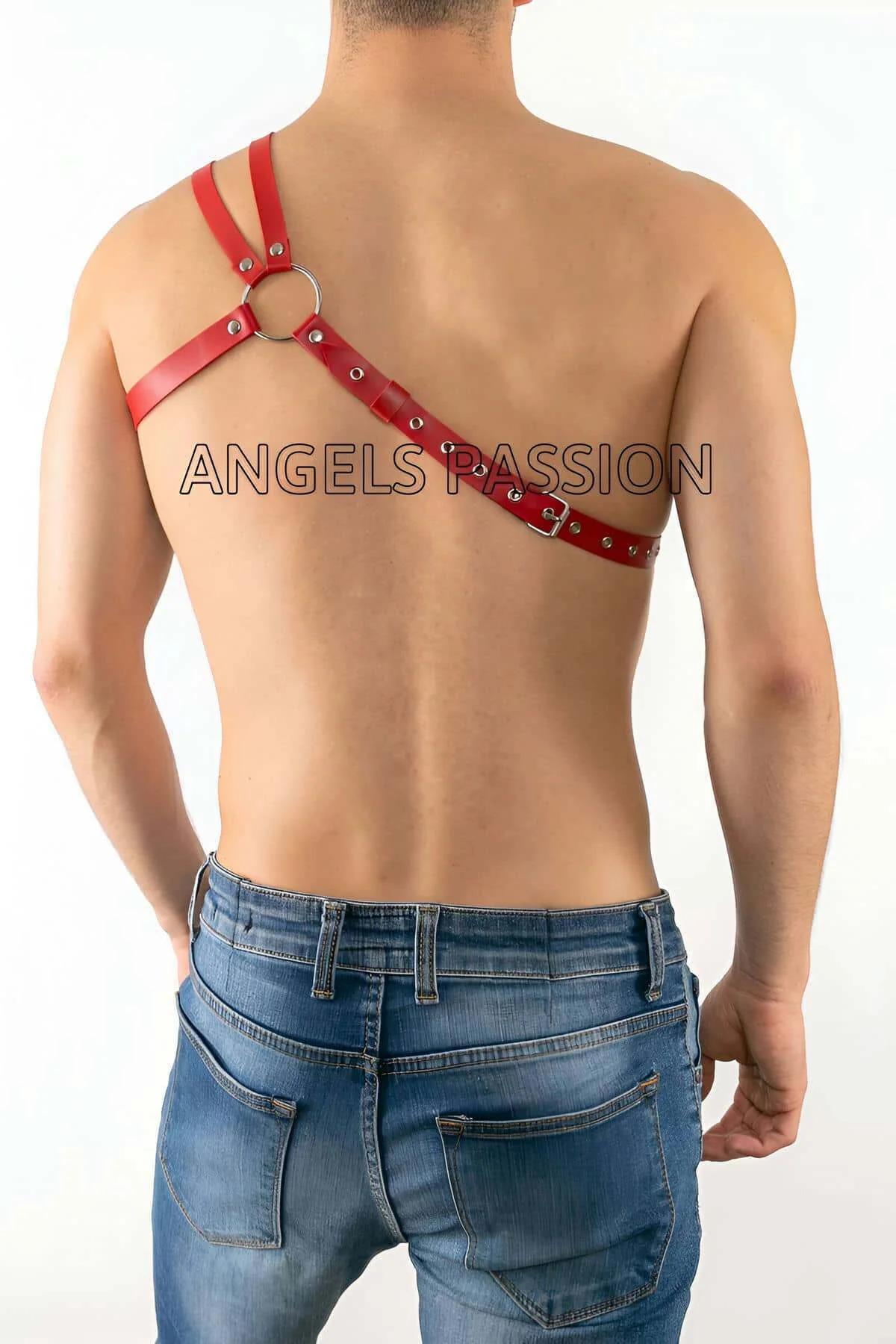close-up of silver O-ring and four rivet hardware on red faux leather chest harness center junction