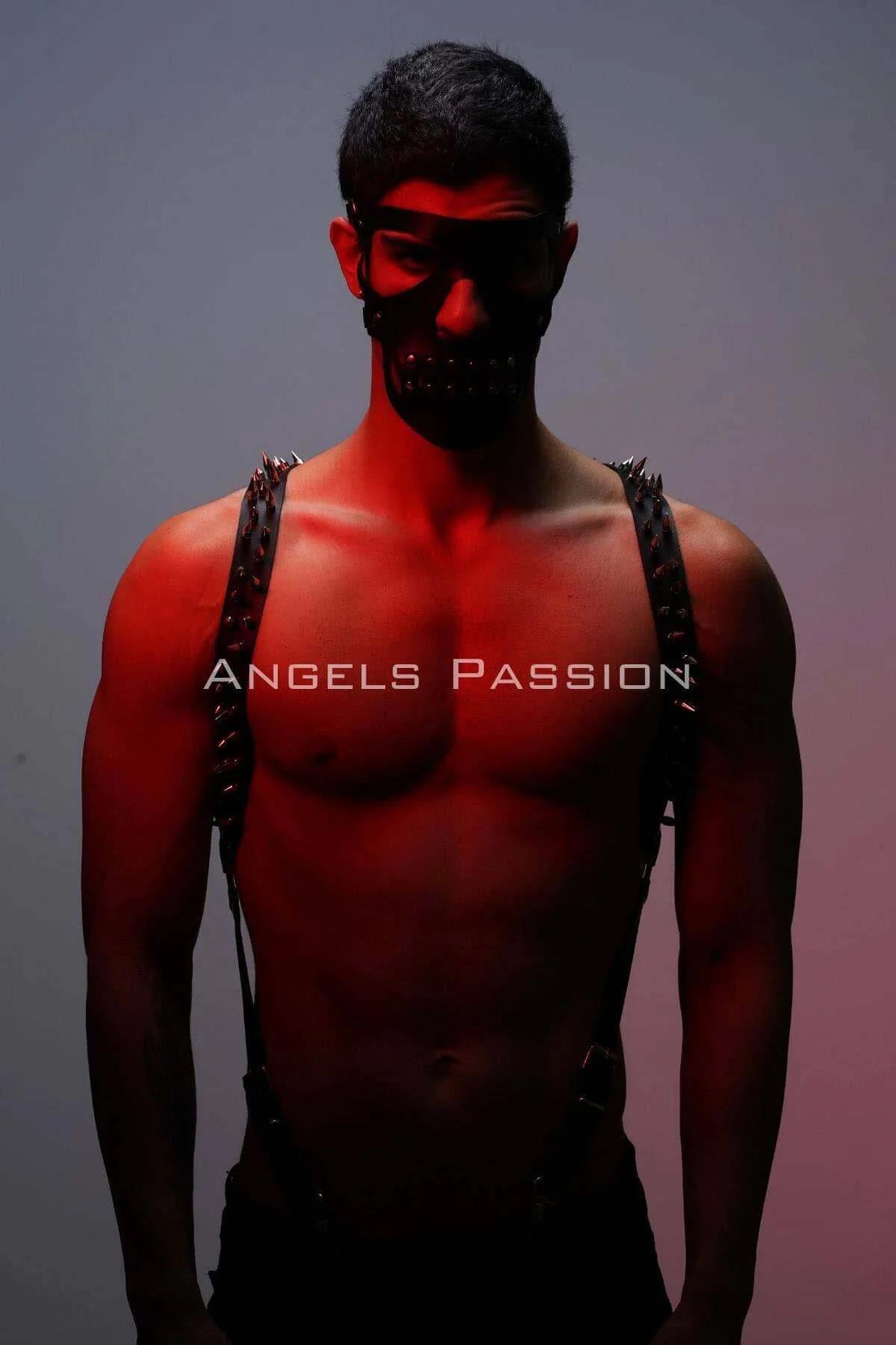 black spike studded harness laid flat showing full strap length and silver hardware connectors