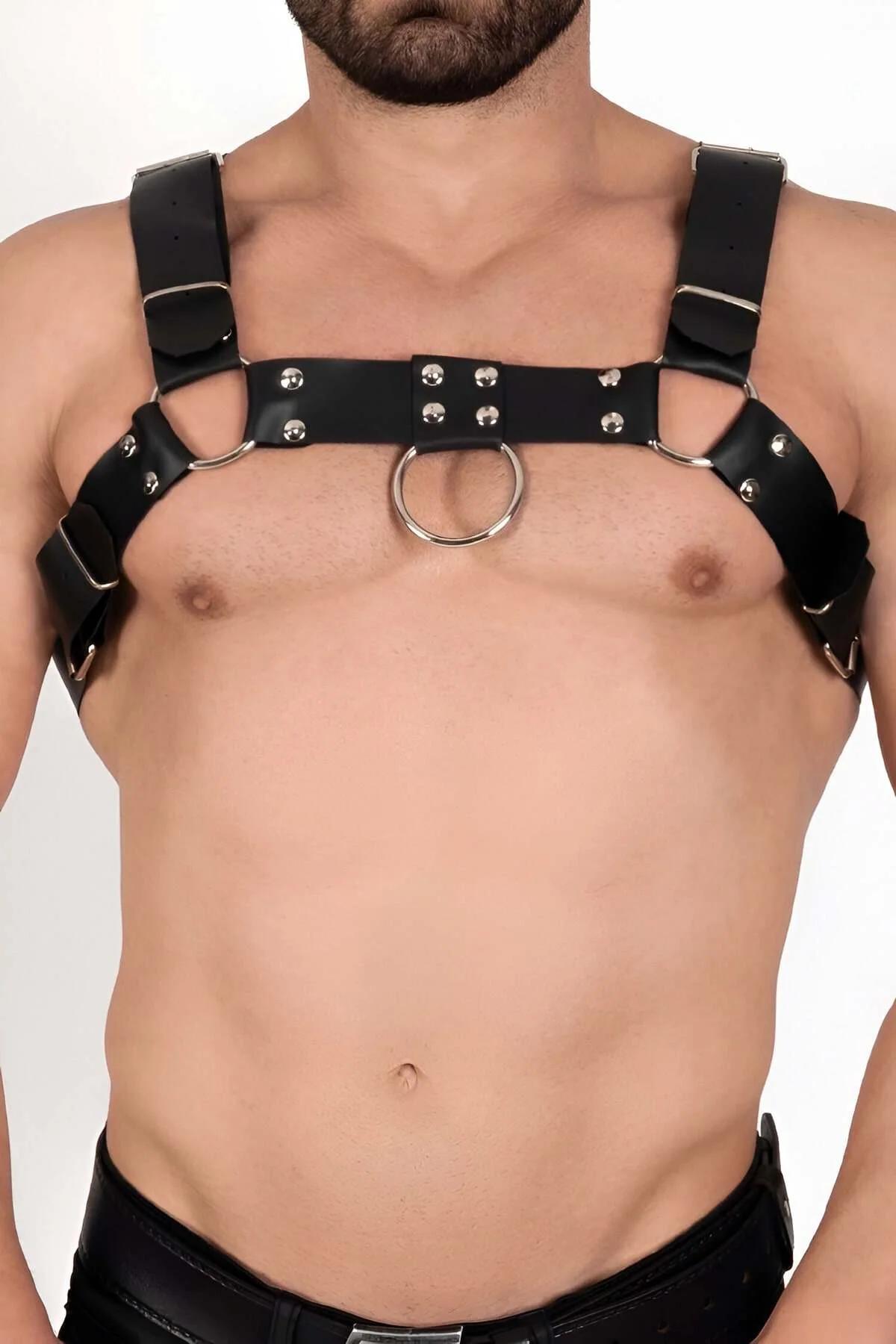 close-up of silver O-ring and dome rivets on black faux leather chest band