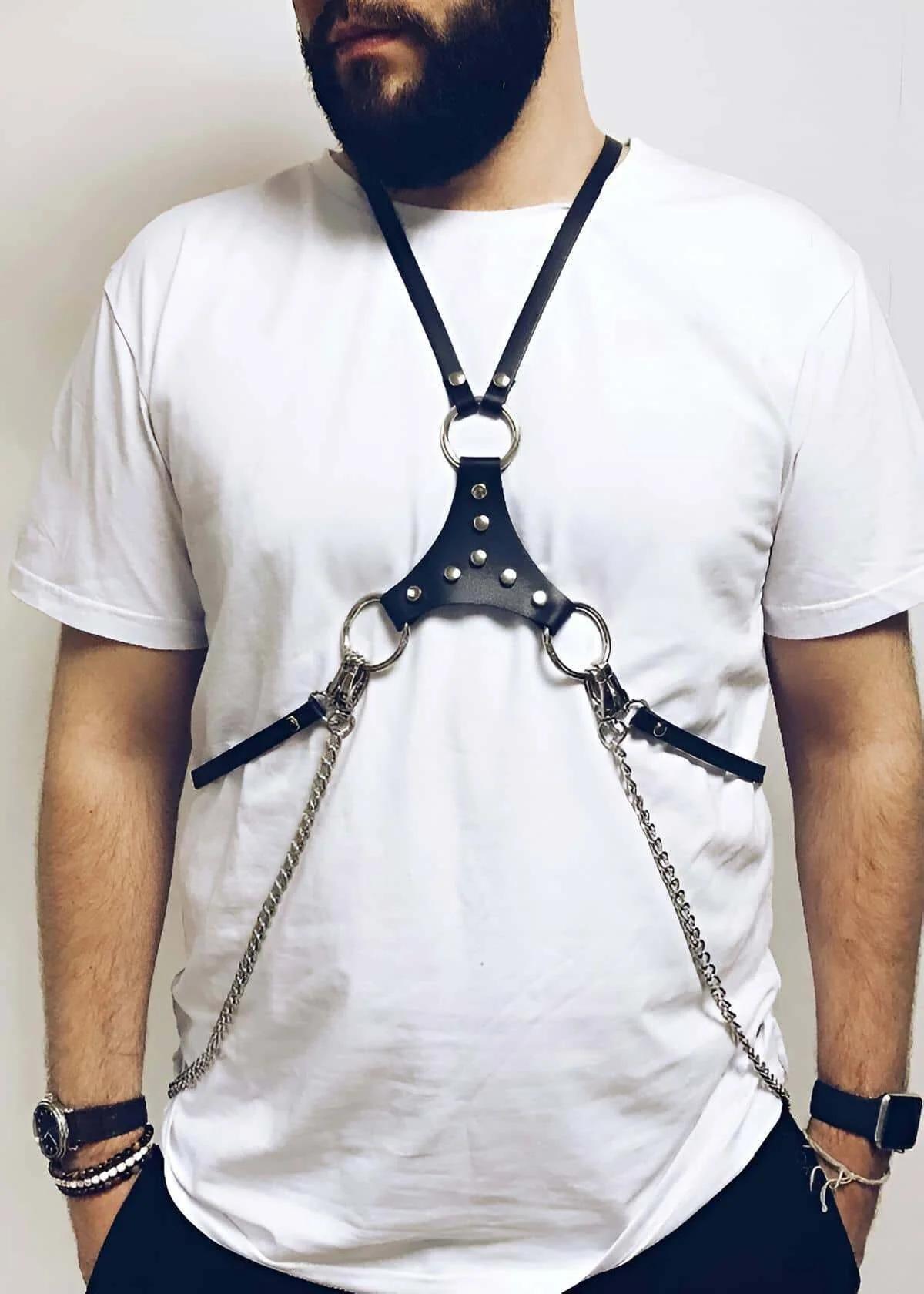 Black adjustable chest harness H-frame back view showing snap stud closures and strap width