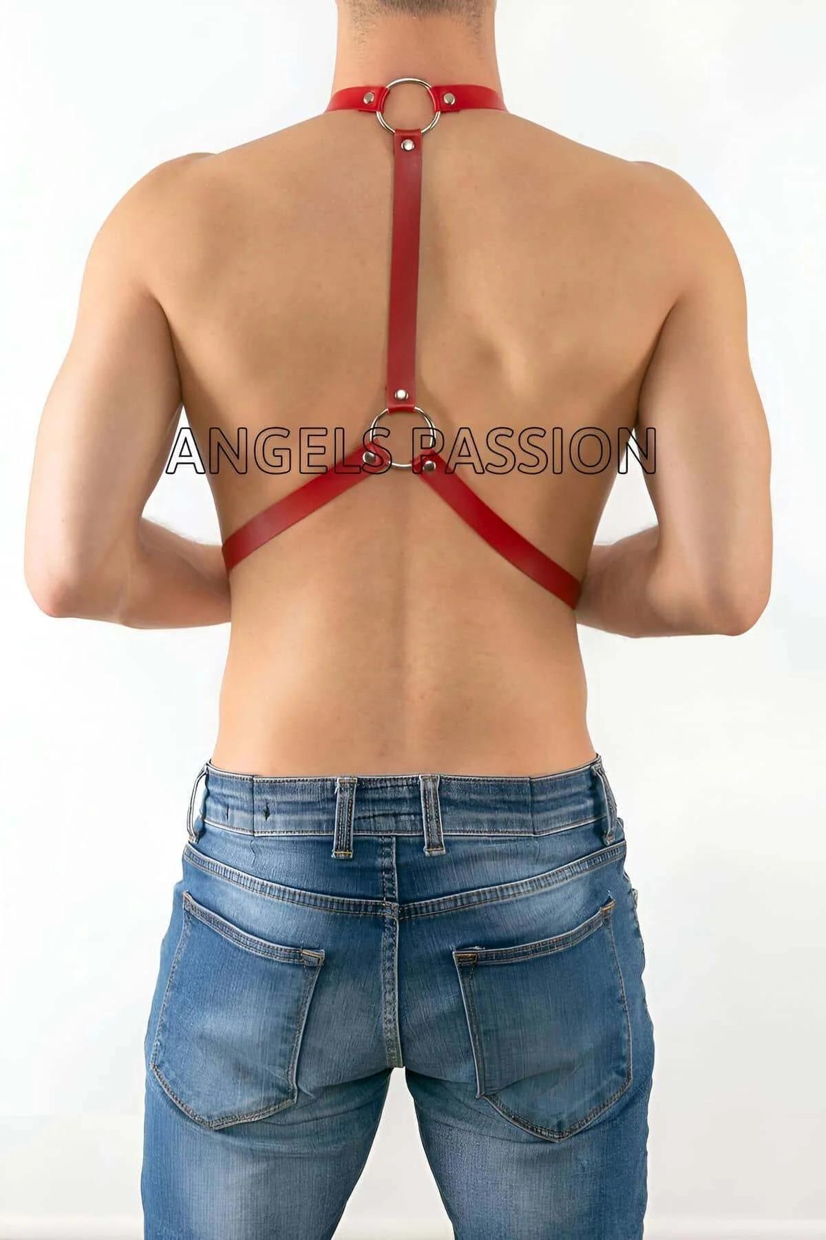 close-up of silver O-rings and sliding buckle on red PU faux leather suspender harness
