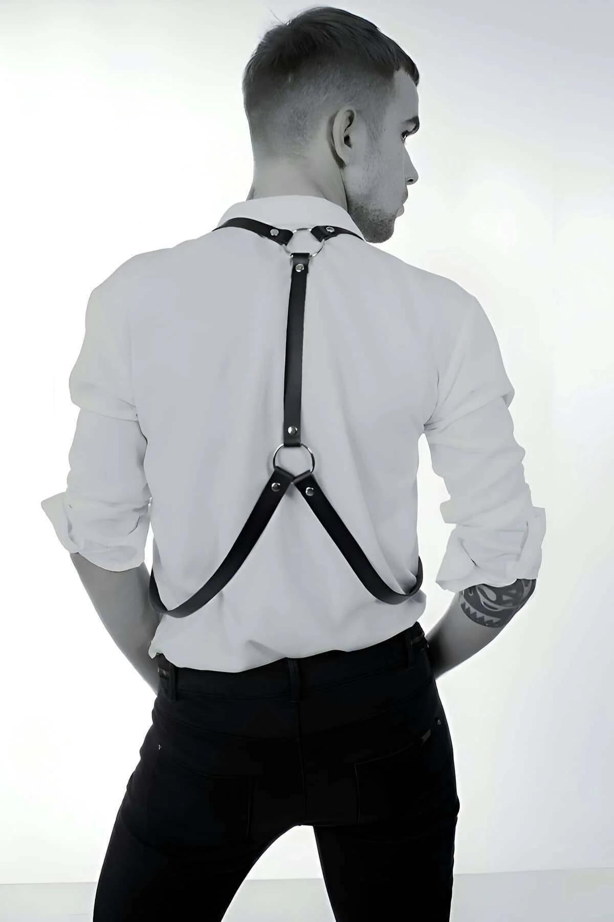 Black adjustable body harness with silver buckles and trouser clips front view detail