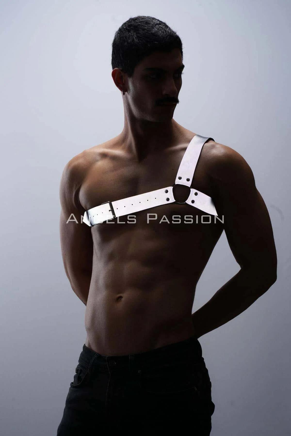 Side angle of white one-shoulder harness showing diagonal strap crossing bare male torso