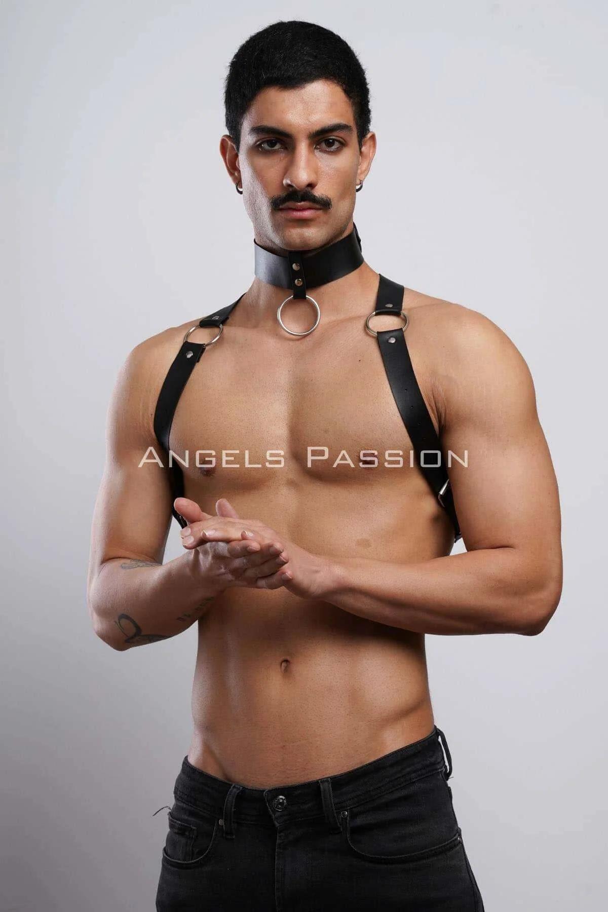 Black faux leather choker and chest harness with three silver O-rings worn by male model over bare chest