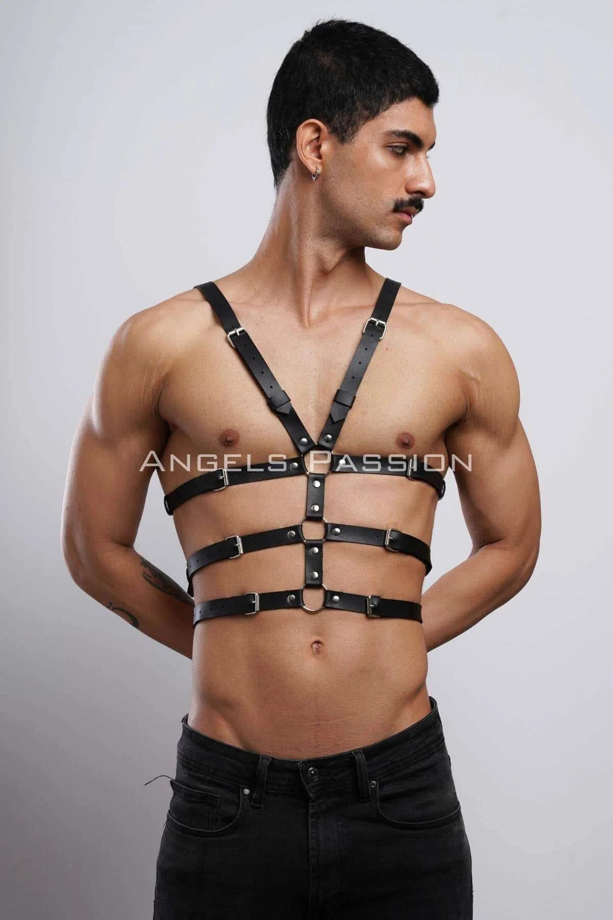close-up black faux leather chest harness four horizontal bands silver pin buckles detail