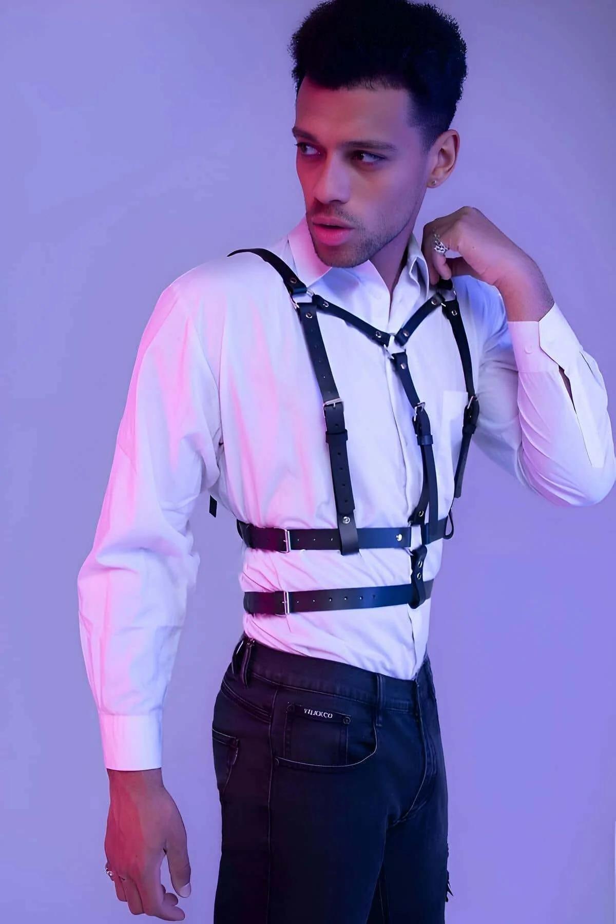 Adjustable black faux leather mens harness showing push-pin buckle and stud detailing