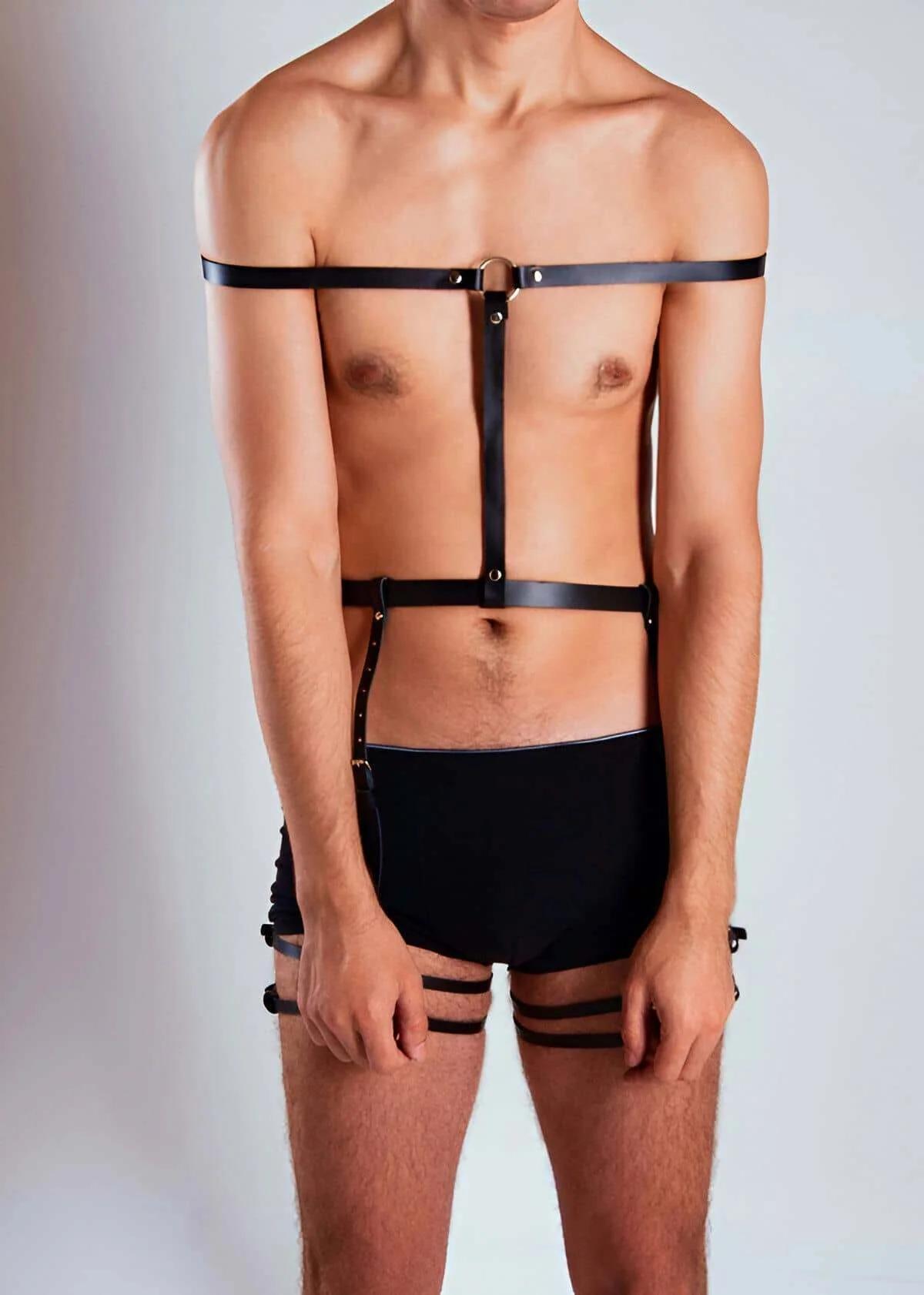 Wide black faux leather waist band with three front snap closures and vertical connecting strap detail