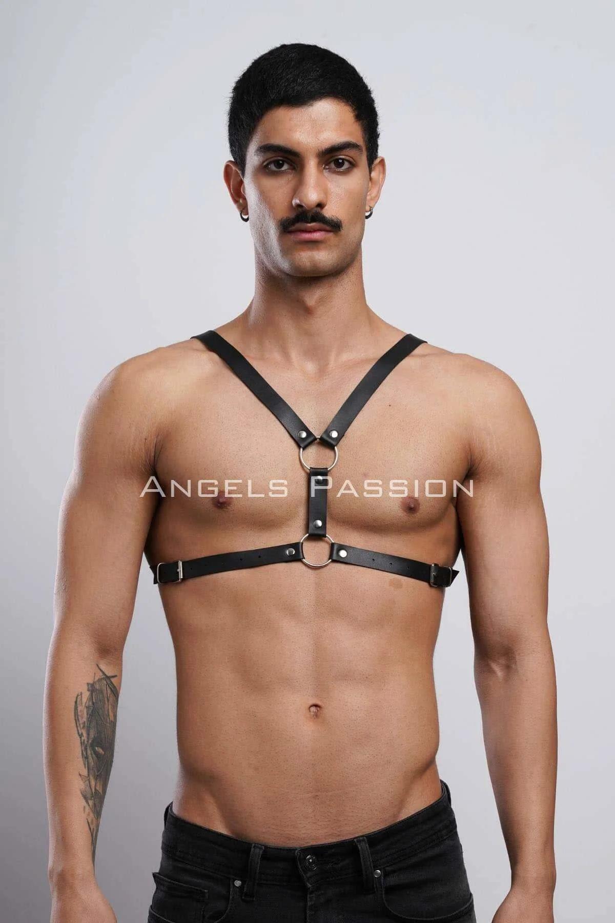 Adjustable waist buckle detail on black faux leather mens harness with silver hardware