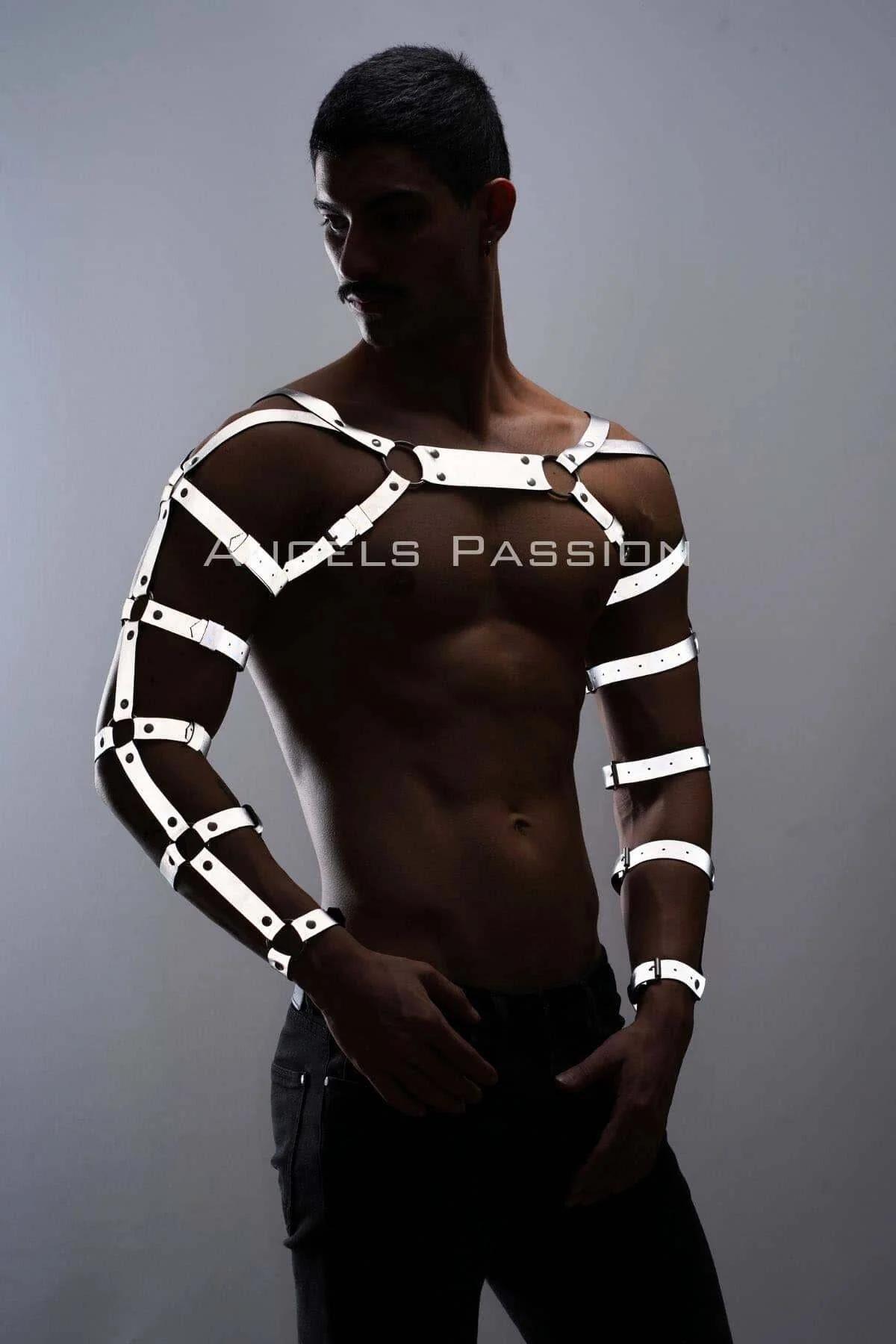 Close-up of white reflective strap buckles and metal rivets on chest harness panel