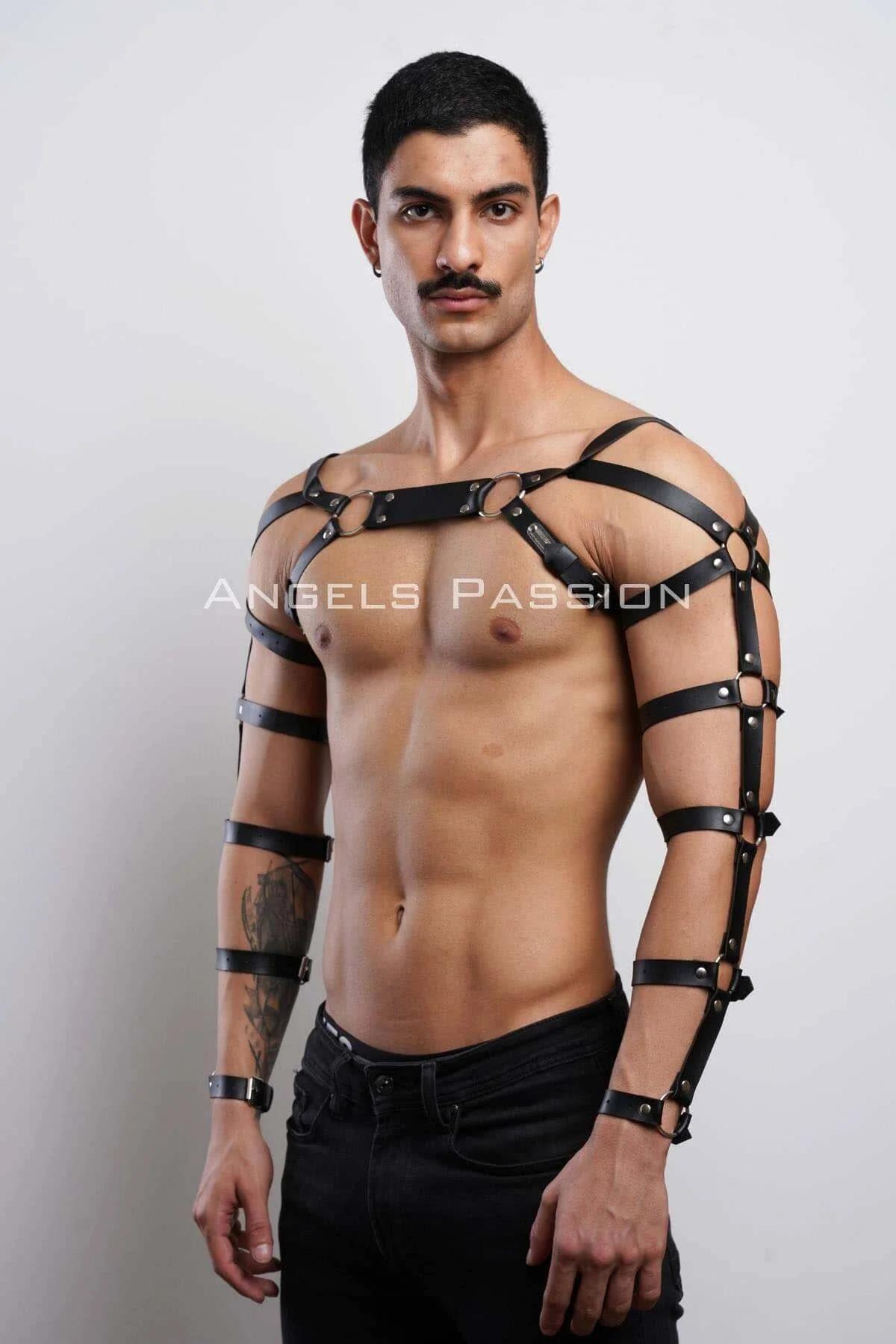 Close-up of silver O-ring and rectangular connector plate on black PU leather chest harness