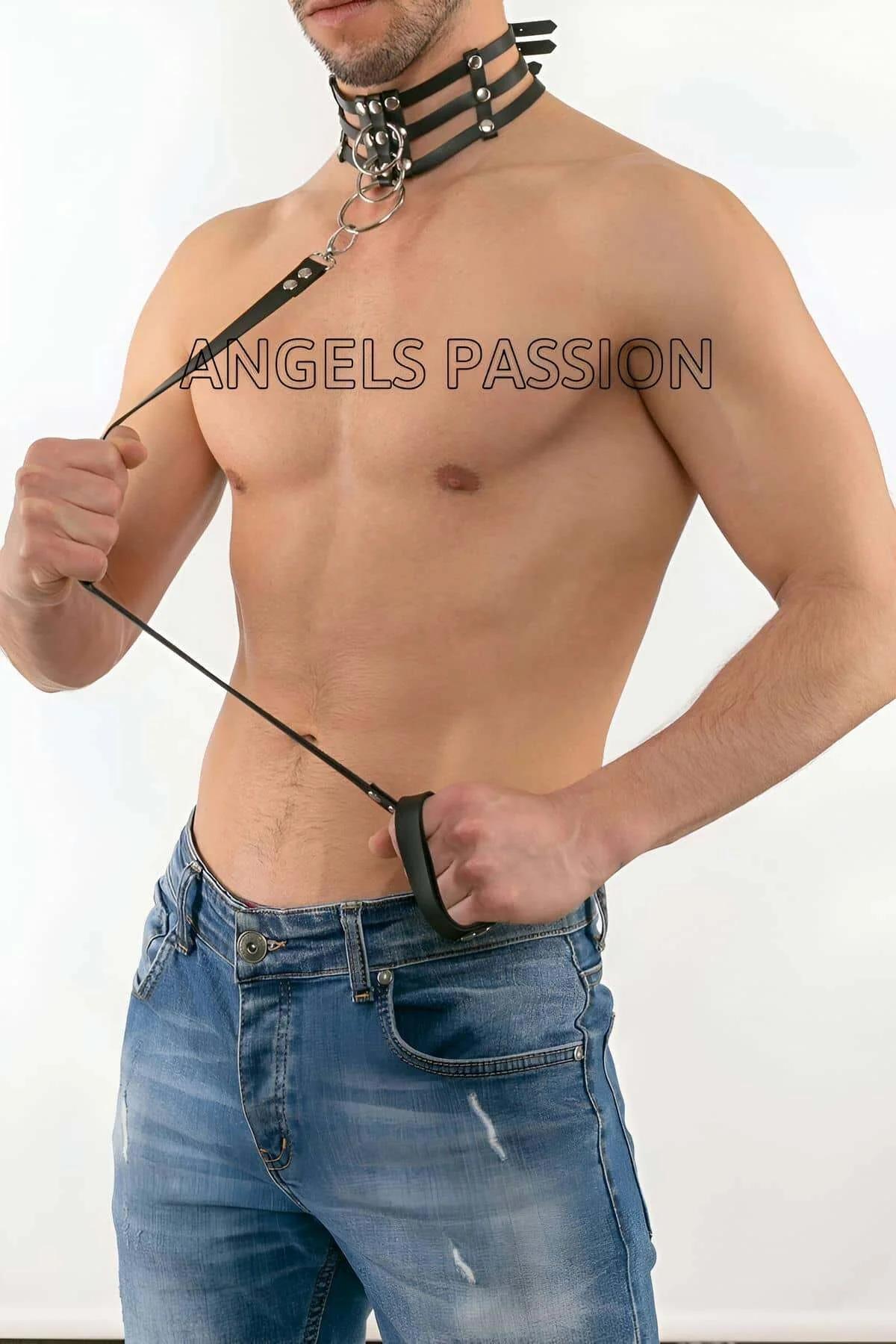 black quad strap harness waist section showing silver clasp and O-ring detail against bare torso