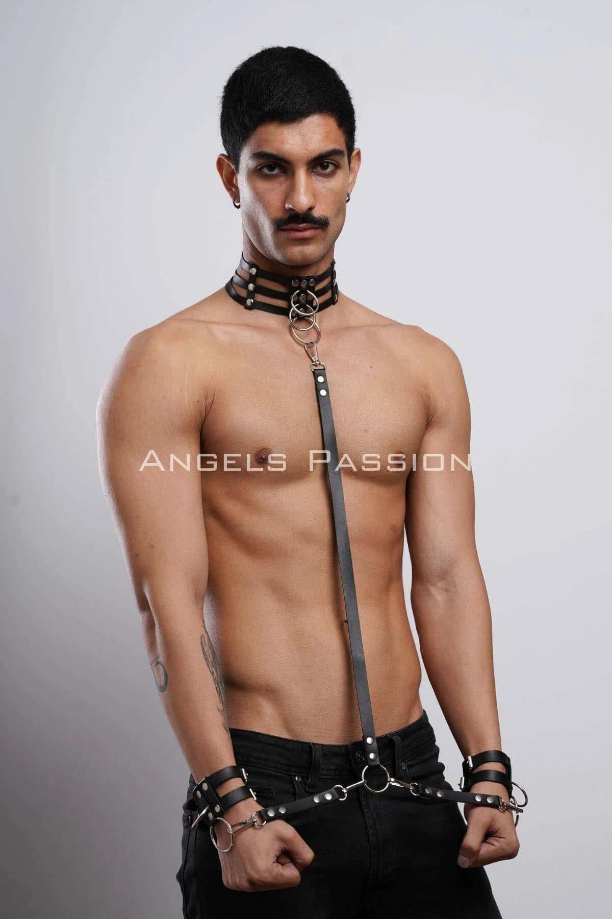 matte black faux leather wrist cuffs with snap hook connections to waist ring