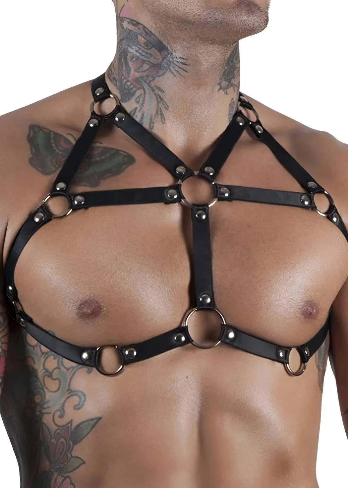 close-up of silver O-ring and rivet stud detail on black faux leather chest harness straps