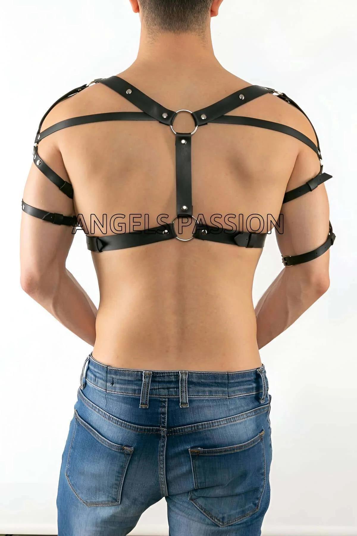 front view of black PU leather chest harness showing center buckle and rib band