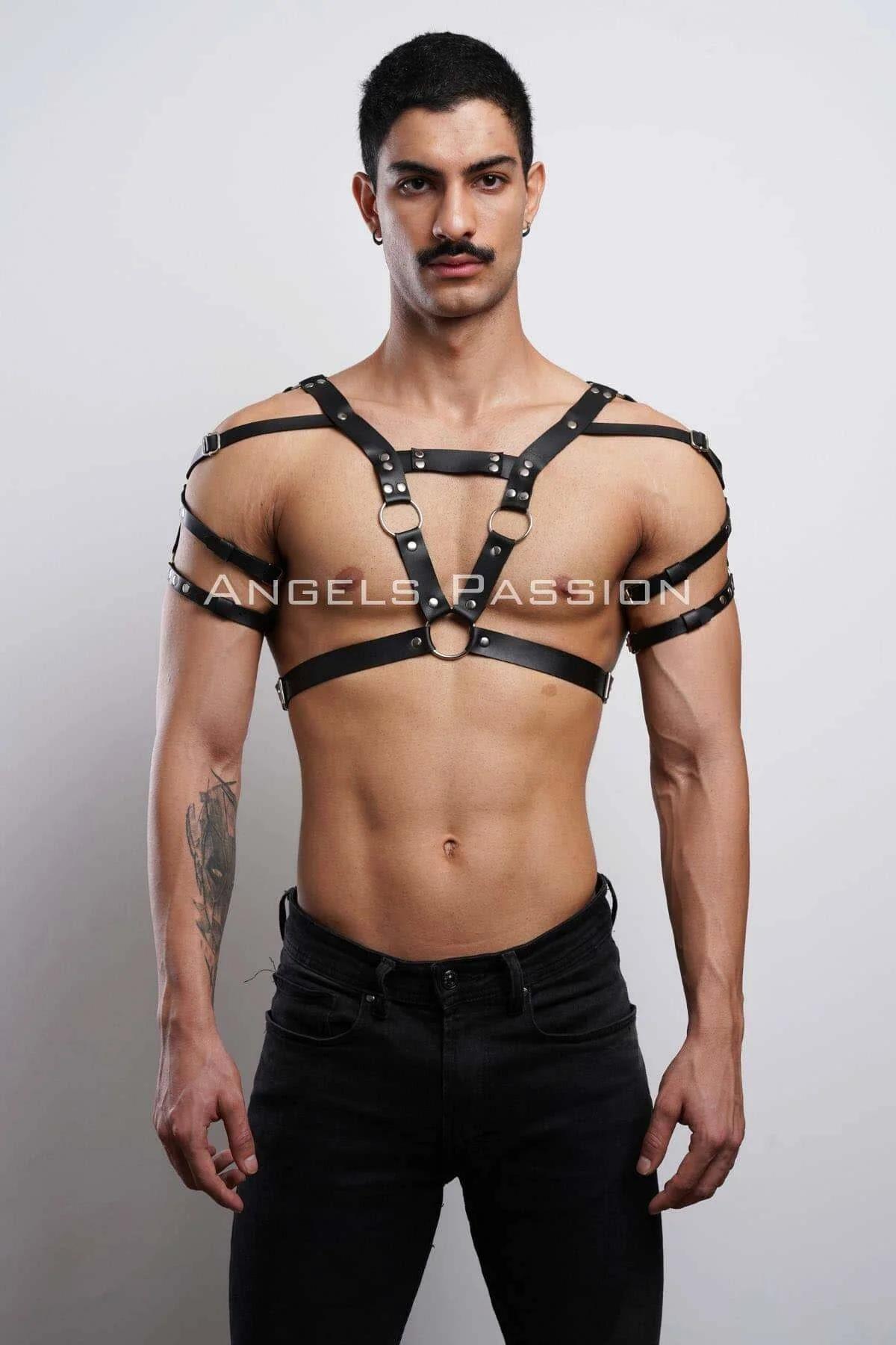 Silver rivet detail along 1.5 cm wide black faux leather strap on adjustable men's chest harness