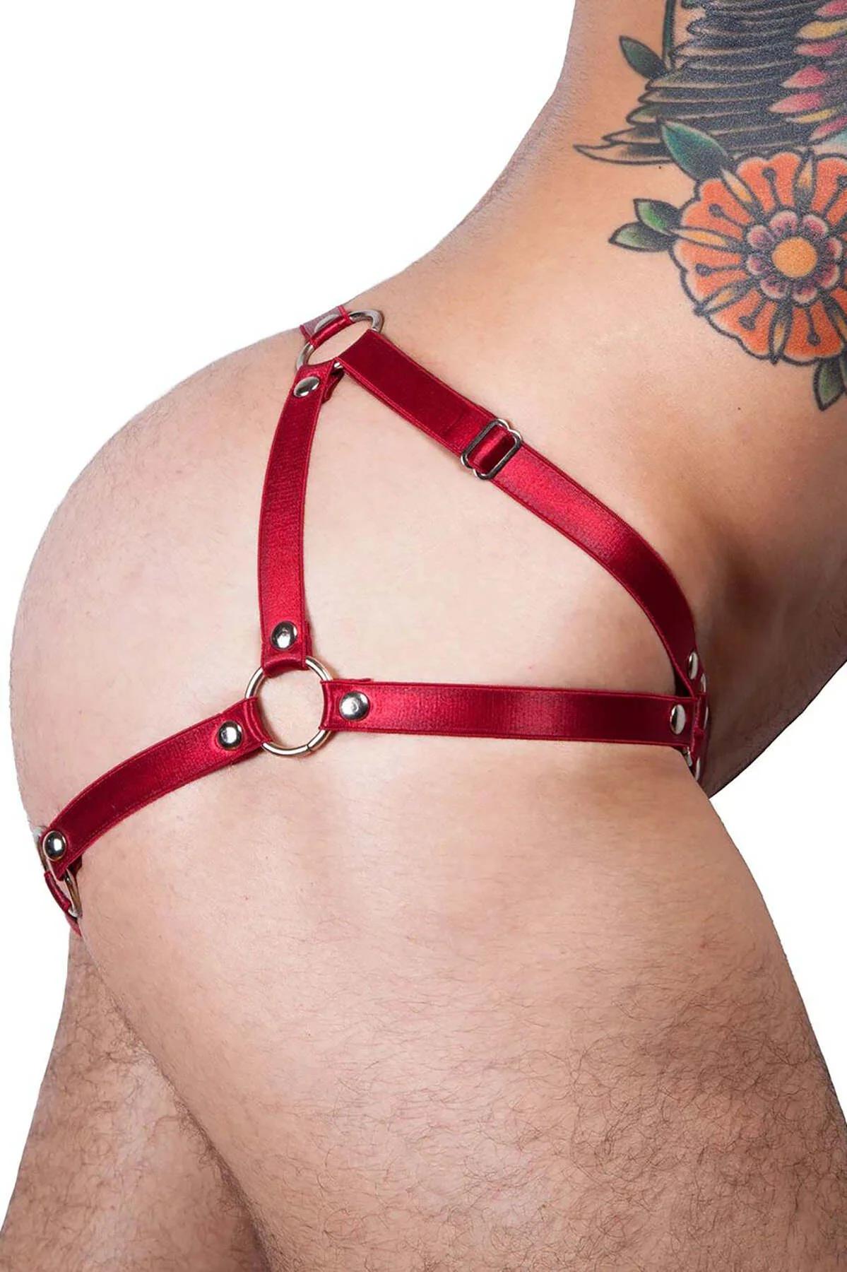 Side view of red g-string harness showing adjustable waist buckle and hip strap layout