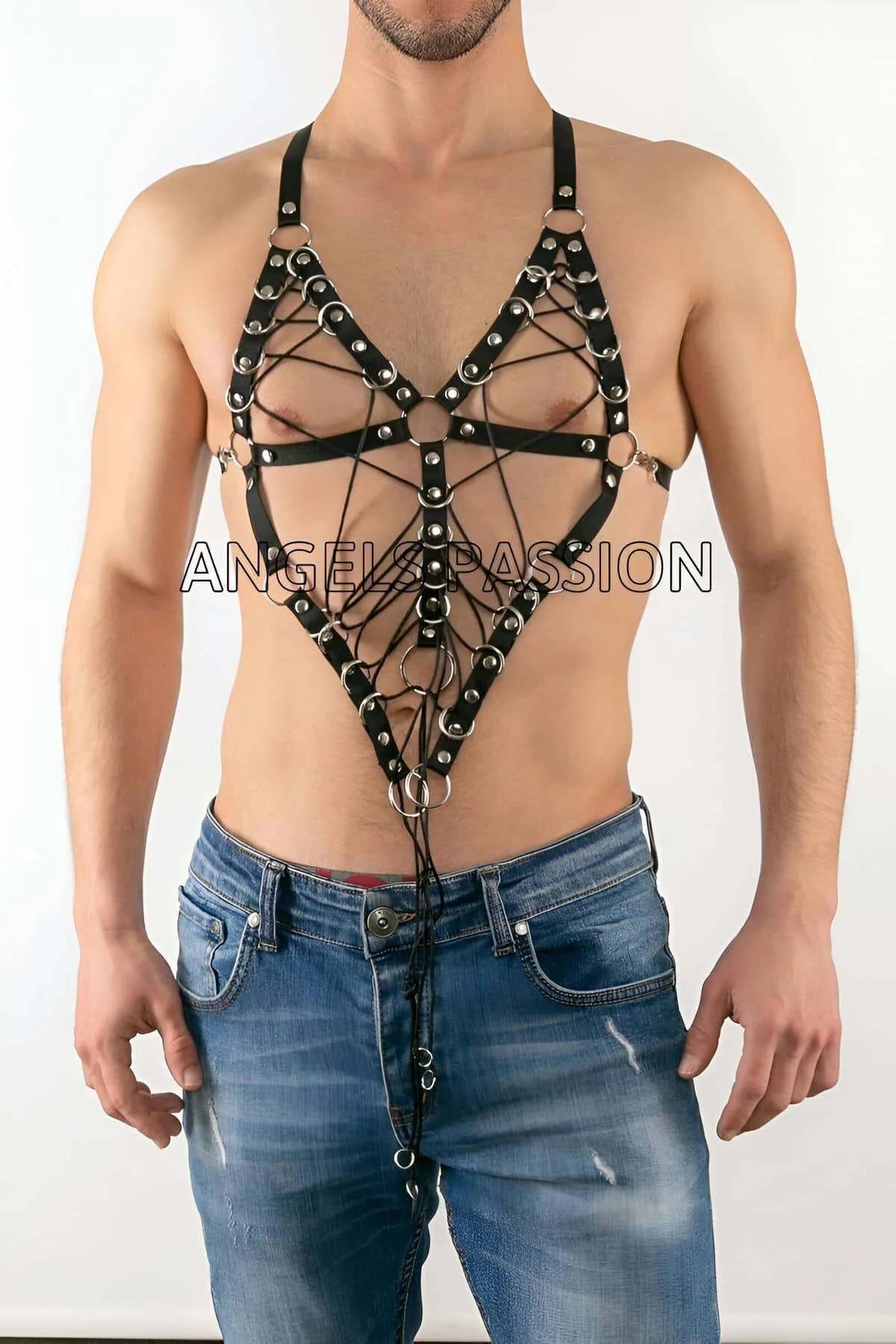 Front detail of black faux leather cage harness showing silver O-rings at strap intersections