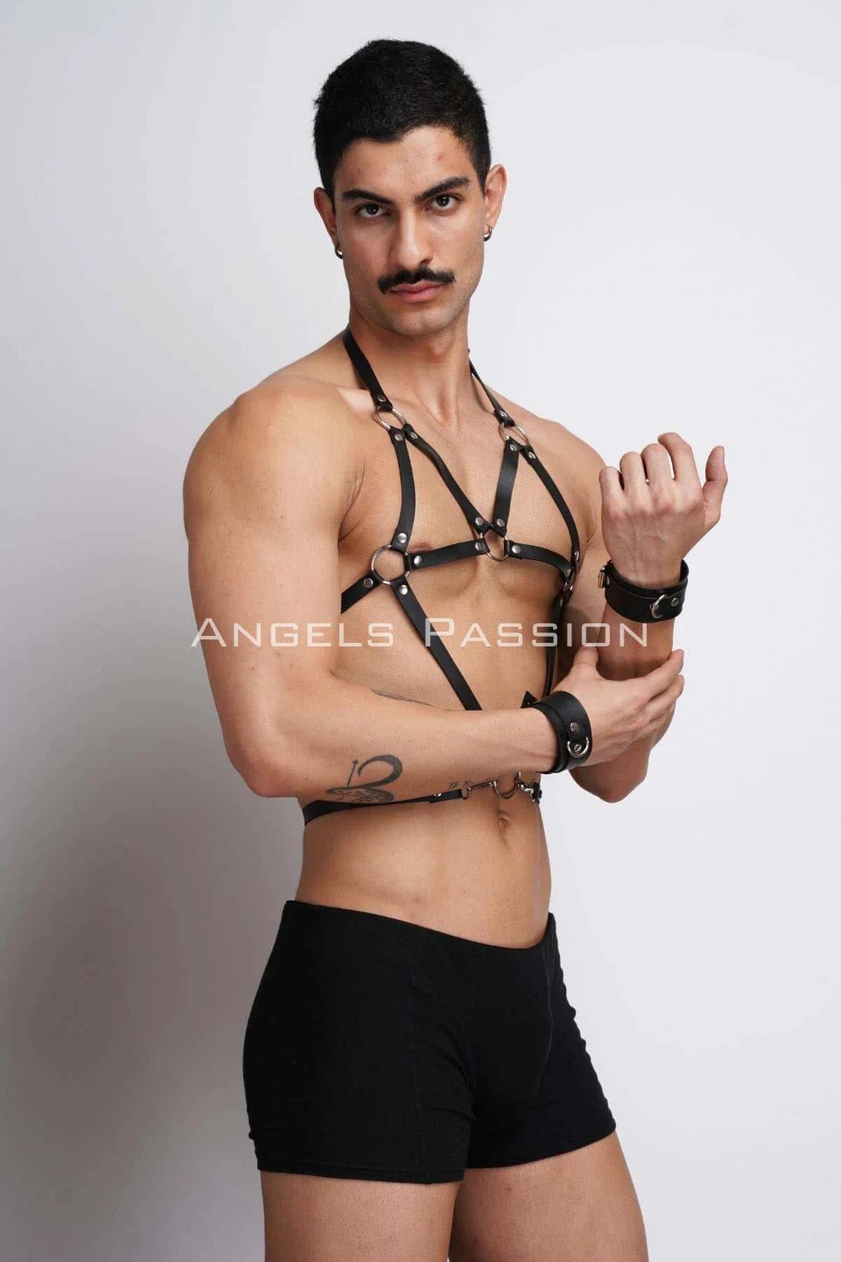 close-up of silver O-ring connectors on black faux leather chest harness straps