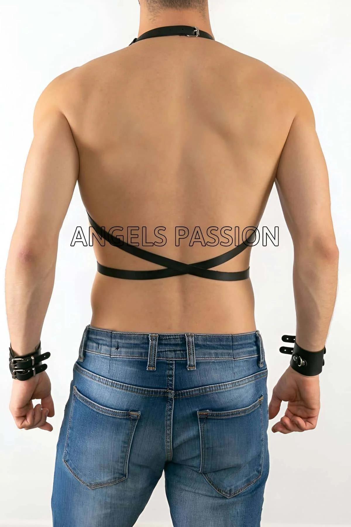 side view of black chest harness showing adjustable buckle slider on shoulder strap